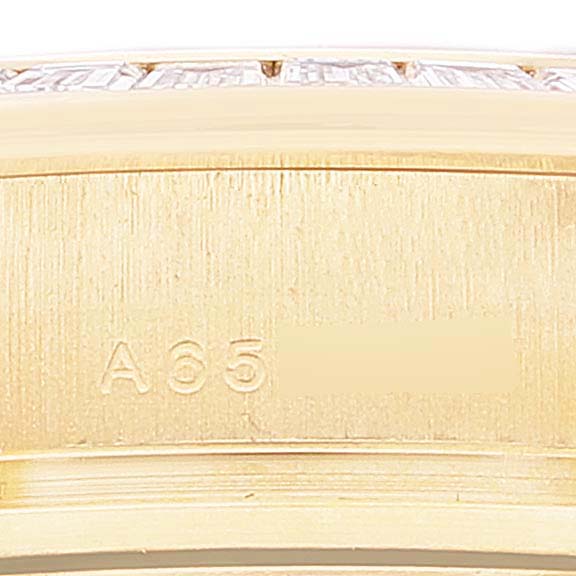 This close-up image shows a partial view of the gold bezel and engraved model number of a Rolex Pearlmaster 80308 Women's Yellow Gold Mother of Pearl Dial 80308 Women's Yellow Gold Mother of Pearl Dial watch.