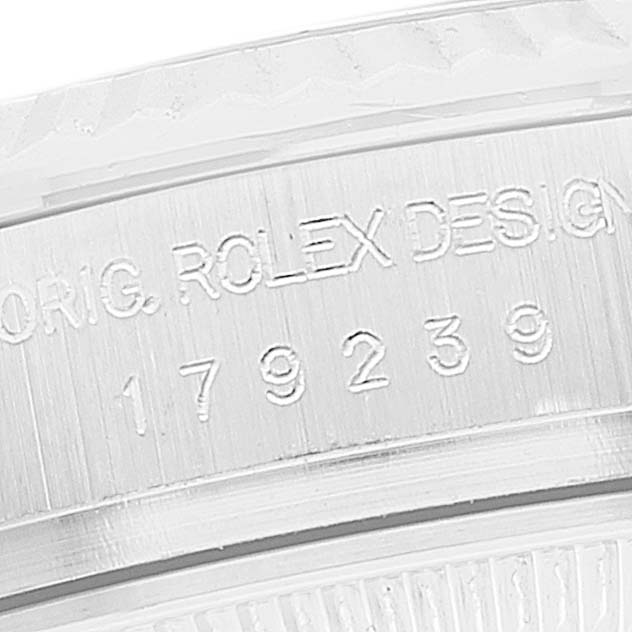 This image shows a close-up of the serial number and "ORIG. ROLEX DESIGN" engraving on a Rolex President 179239 Women's White Gold Mother of Pearl Dial 179239 Women's White Gold Mother of Pearl Dial model watch casing.