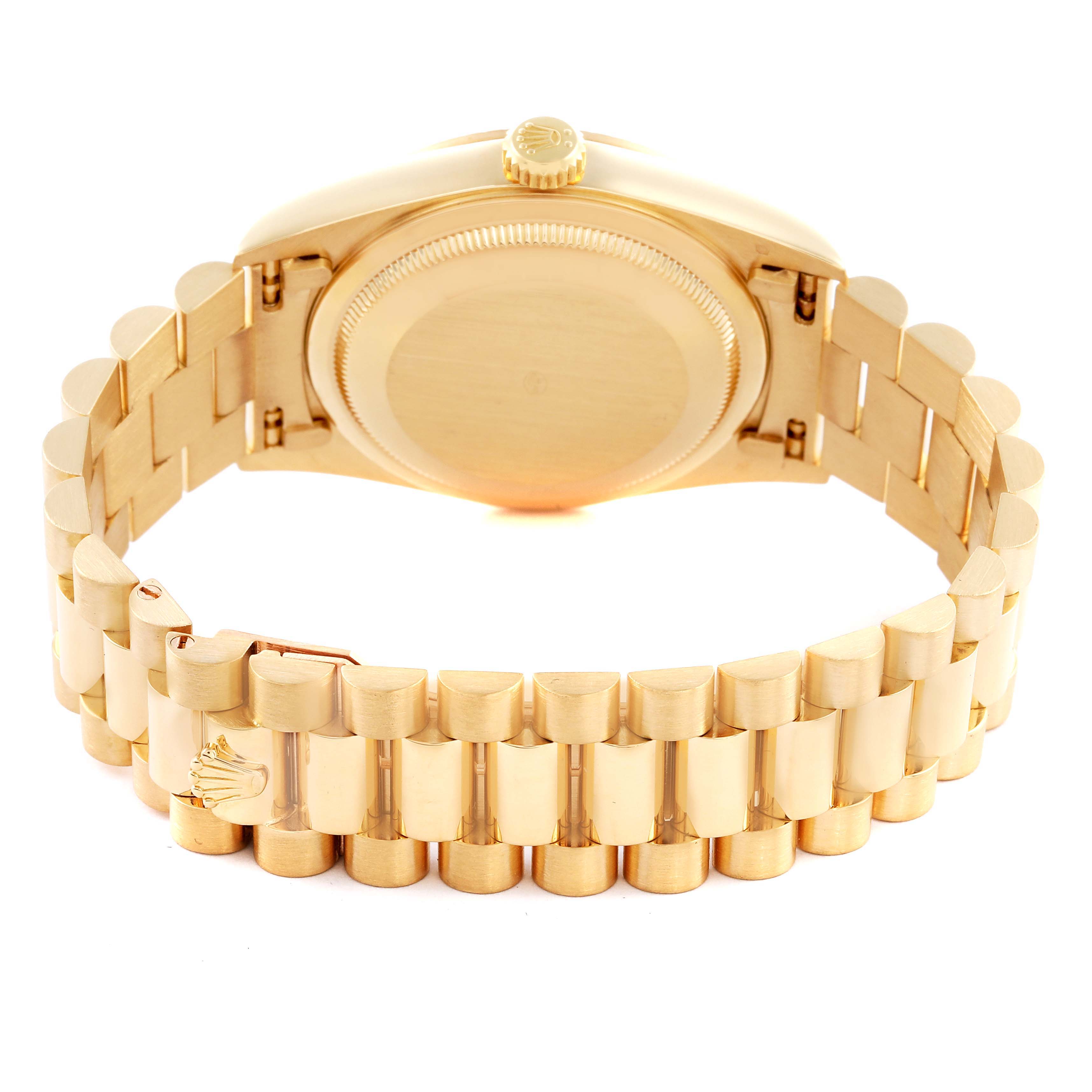 The Rolex President 18238 Men
s Yellow Gold Champagne Dial 18238 Men
s Yellow Gold Champagne Dial model watch is shown from the back, highlighting the bracelet and case back.