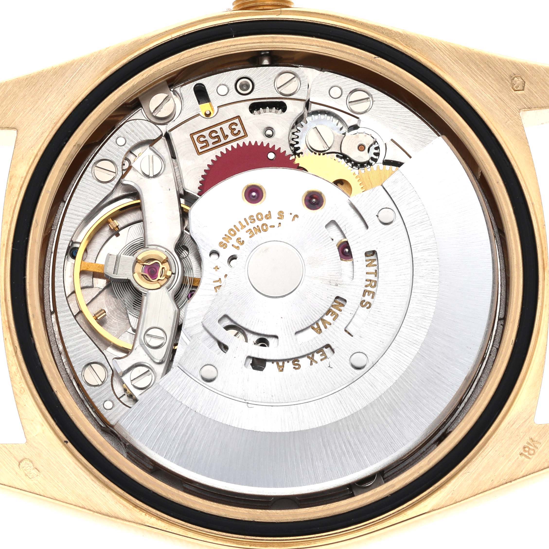 The image shows the intricate movement and internal mechanics of a Rolex President 18238 Men
s Yellow Gold Champagne Dial 18238 Men
s Yellow Gold Champagne Dial watch from a back view.