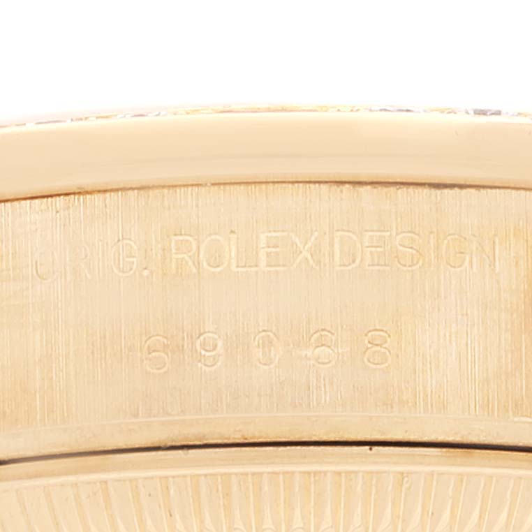 The image shows a close-up of the engraved inscription and model number on the case side of a Rolex President 69068 Women's Yellow Gold Mother of Pearl Dial 69068 Women's Yellow Gold Mother of Pearl Dial watch.