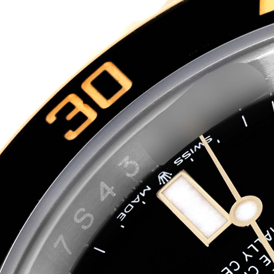 The image shows a close-up of the dial and bezel of a Rolex Submariner 126613 Men
s Steel and Gold (two tone) Black Dial, highlighting the 
30
 marker and part of the hands.