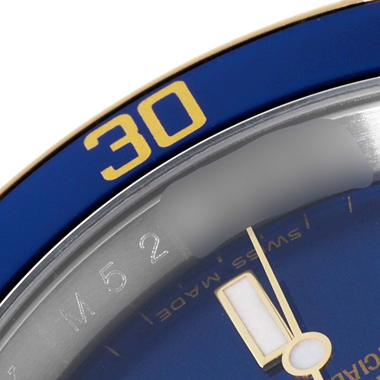 The angle shows a close-up of the bezel, dial, and minute hand of the Rolex Submariner 16613 Men's Steel and Gold (two tone) Blue Dial 16613 Men's Steel and Gold (two tone) Blue Dial watch.