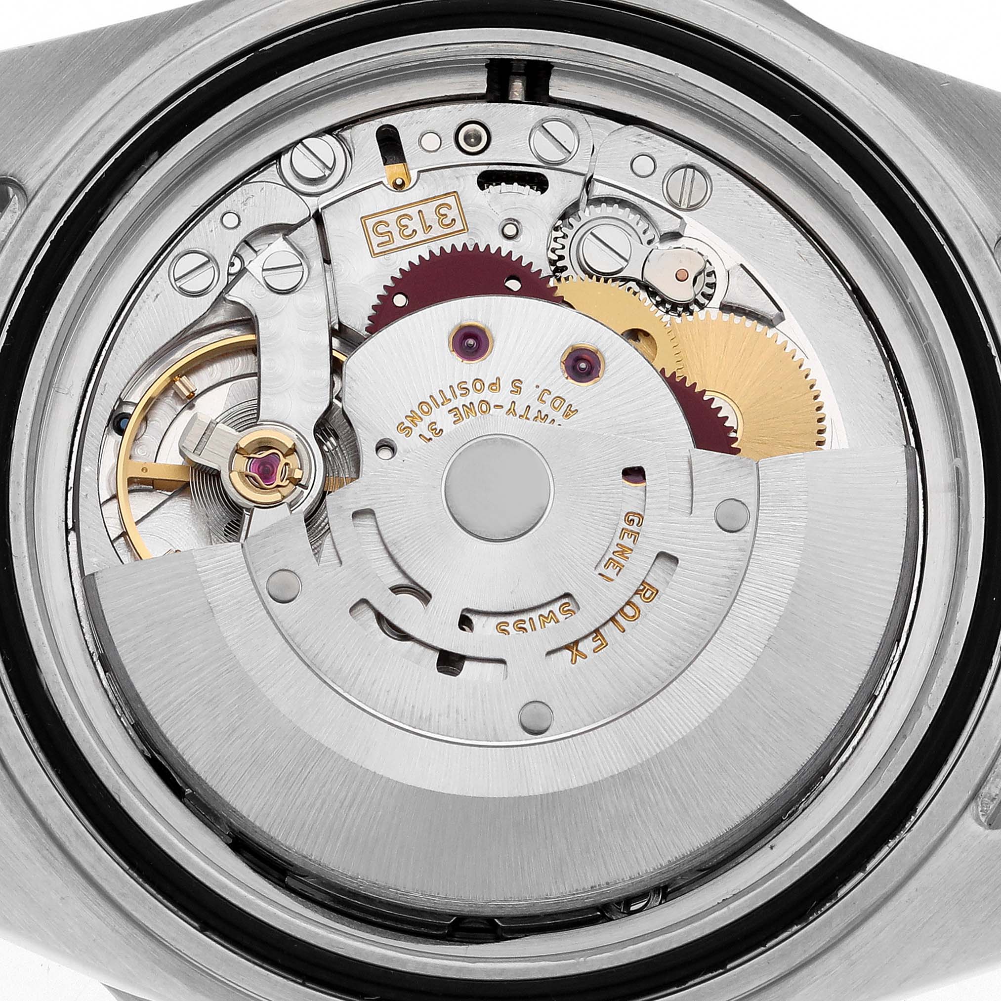 The image shows a close-up view of the Rolex Submariner 16610 Men
s Stainless Steel Black Dial 16610 Men
s Stainless Steel Black Dial
s watch movement, highlighting the internal mechanical parts.