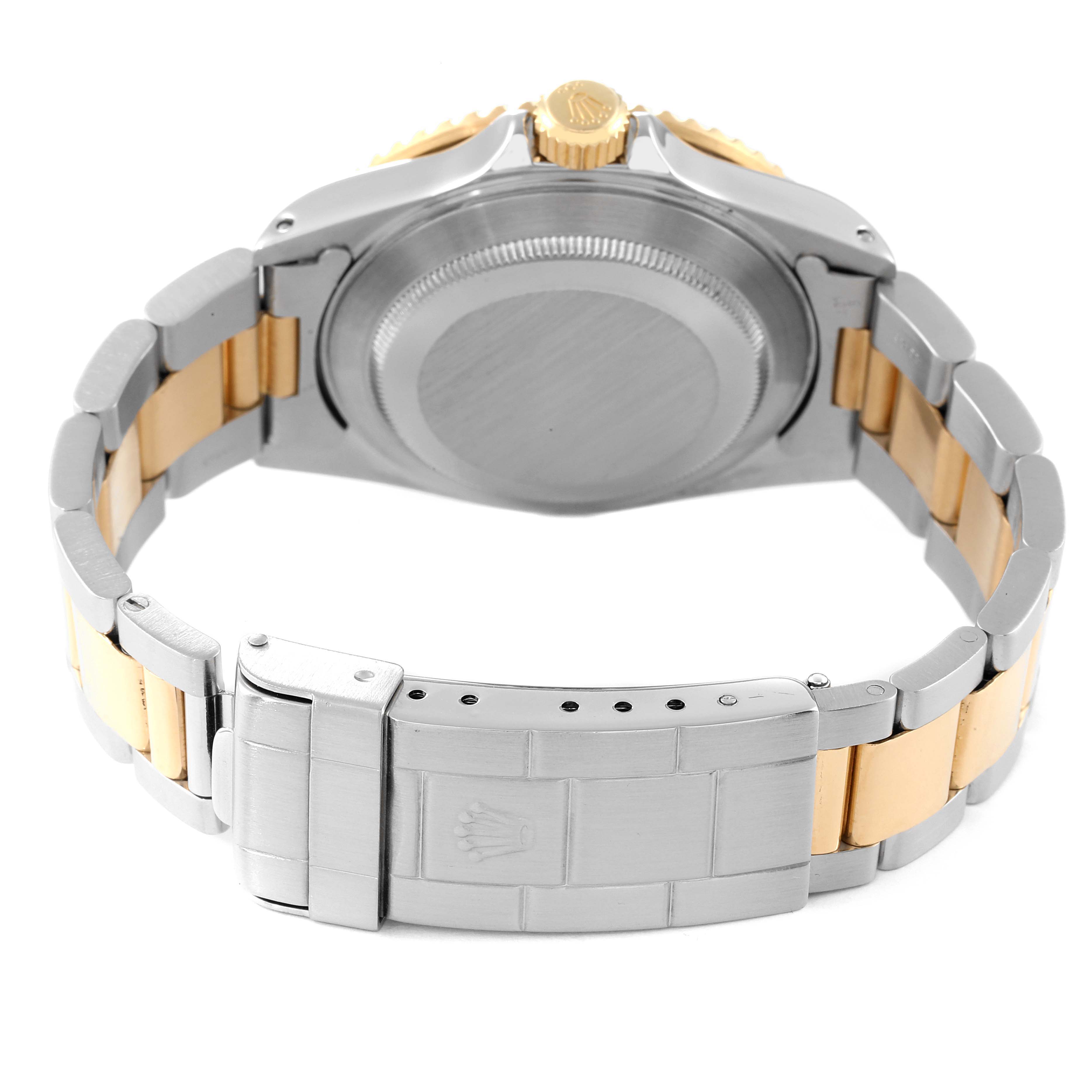 The image shows the back case and bracelet of a Rolex Submariner 16613 Men's Steel and Gold (two tone) Black Dial 16613 Men's Steel and Gold (two tone) Black Dial watch, viewed from the rear.