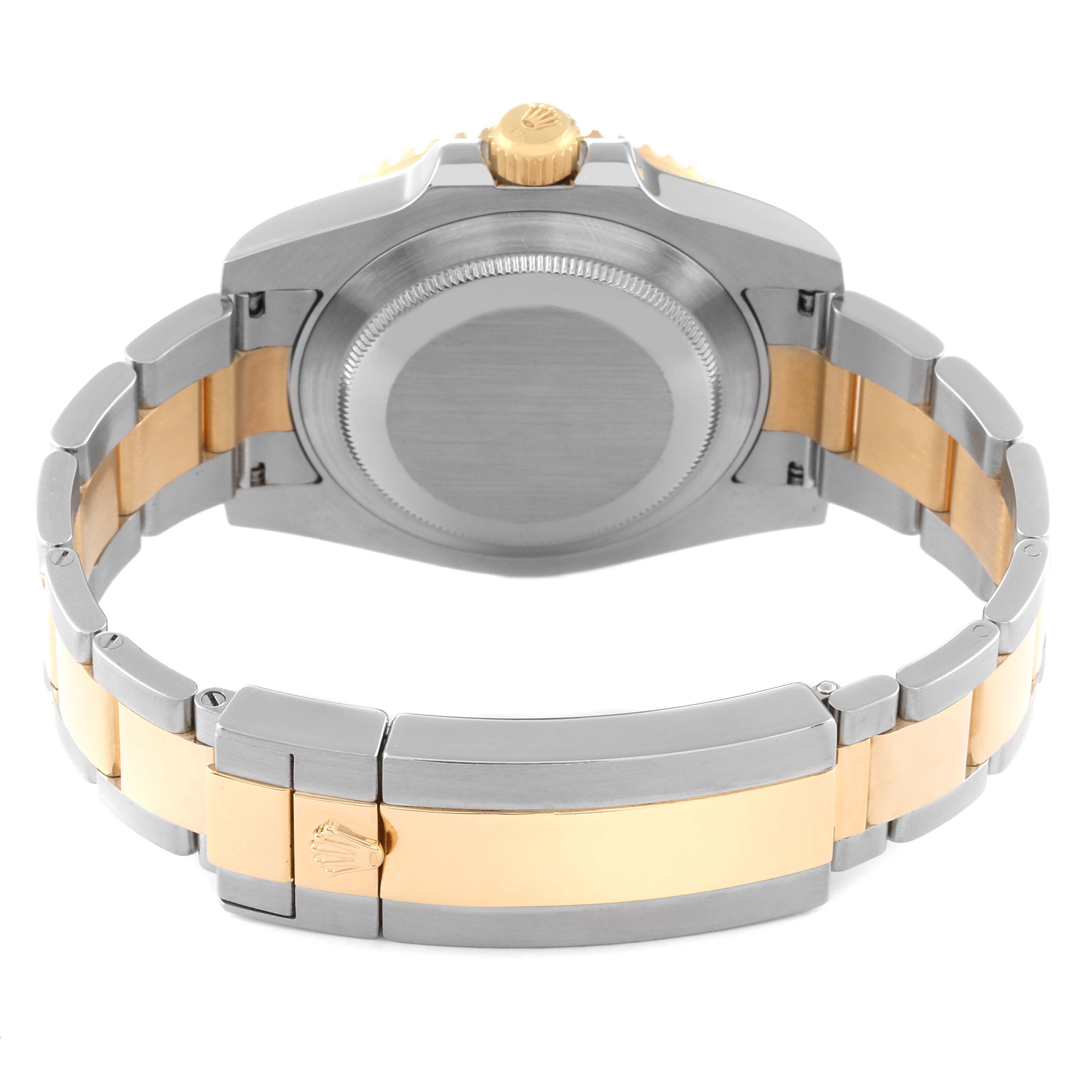 This image shows the back view of a Rolex Submariner 116613 Men's Steel and Gold (two tone) Blue Dial 116613 Men's Steel and Gold (two tone) Blue Dial watch, highlighting its stainless steel and gold bracelet along with the case back.