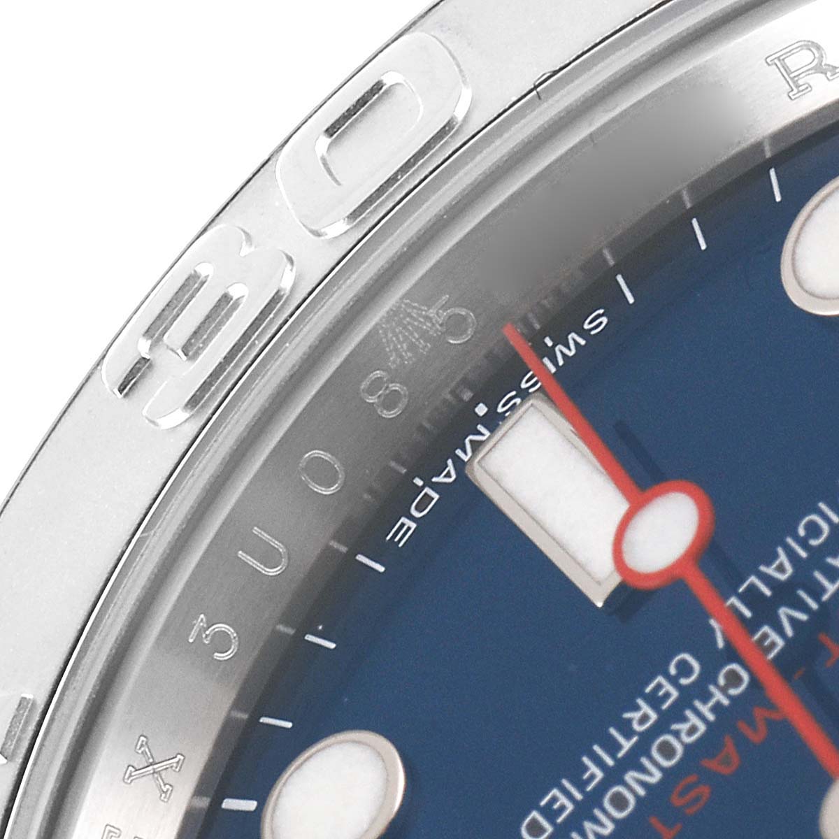 This close-up image of the Rolex Yacht-Master 116622 Men's Stainless Steel Blue Dial 116622 Men's Stainless Steel Blue Dial watch shows part of the bezel, dial, and second hand.