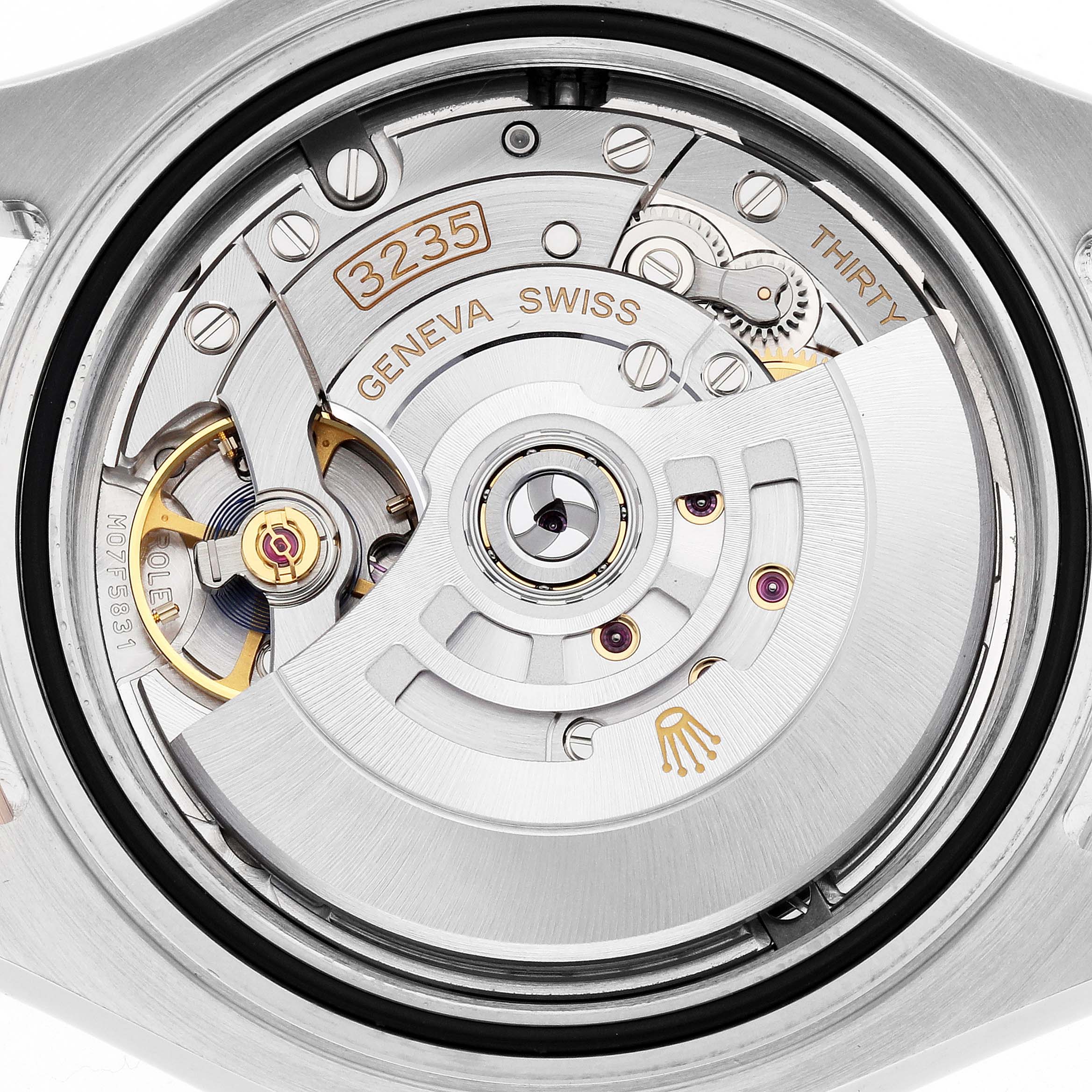 The image shows the Rolex Yacht-Master 126621 Men's Steel and Gold (two tone) Black Dial's movement from a rear angle, highlighting its caliber 3235 and intricate rotor mechanism.