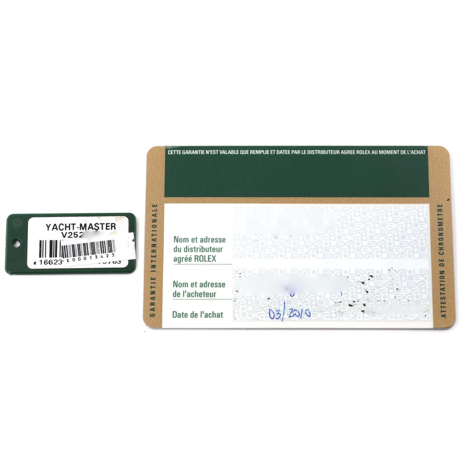 The image shows a tag and warranty card for the Rolex Yacht-Master 16623 Men
s Stainless Steel White Dial 16623 Men
s Stainless Steel White Dial model, with identifiable text and spaces for information.