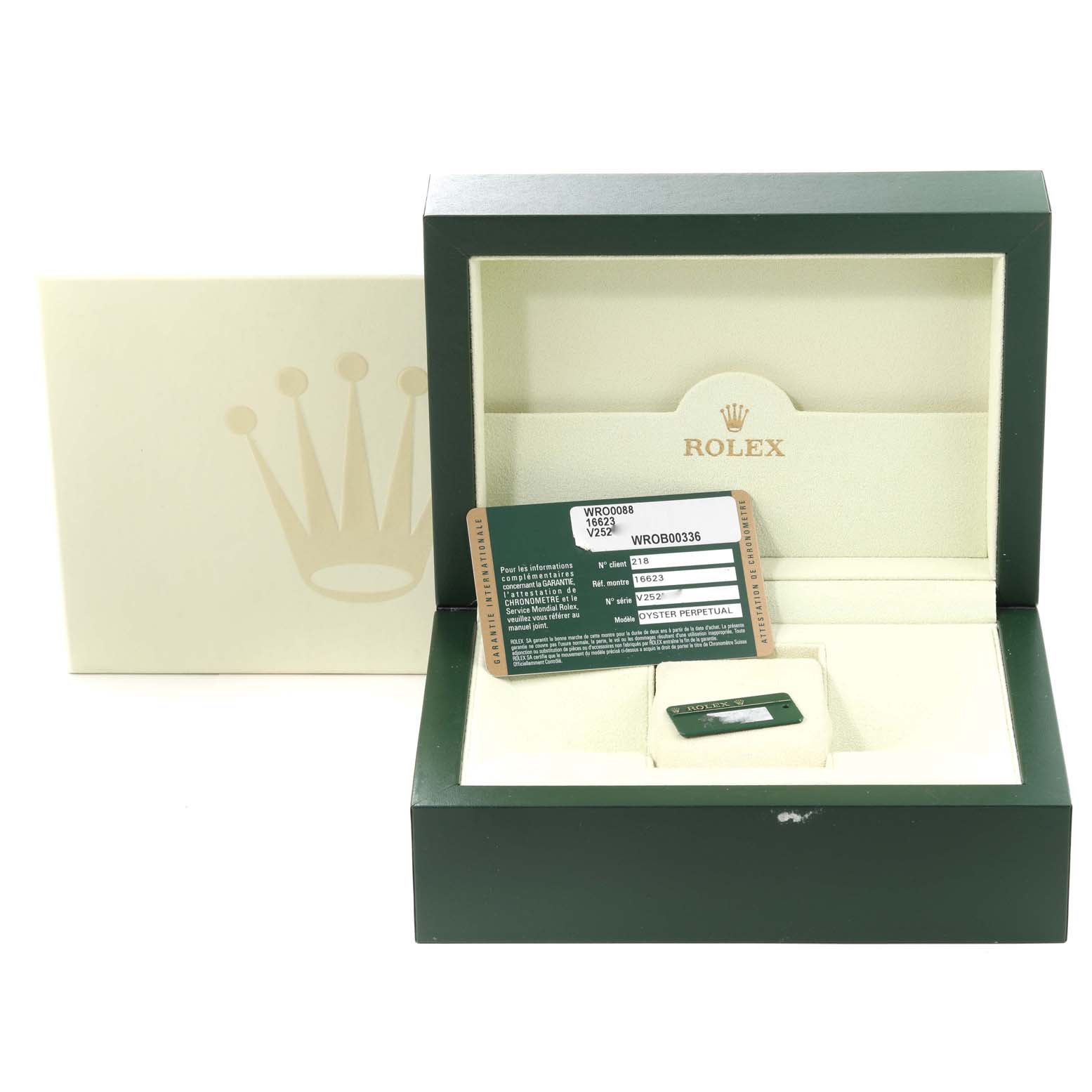 This image shows the open packaging box for the Rolex Yacht-Master 16623 Men
s Stainless Steel White Dial 16623 Men
s Stainless Steel White Dial model along with warranty cards.