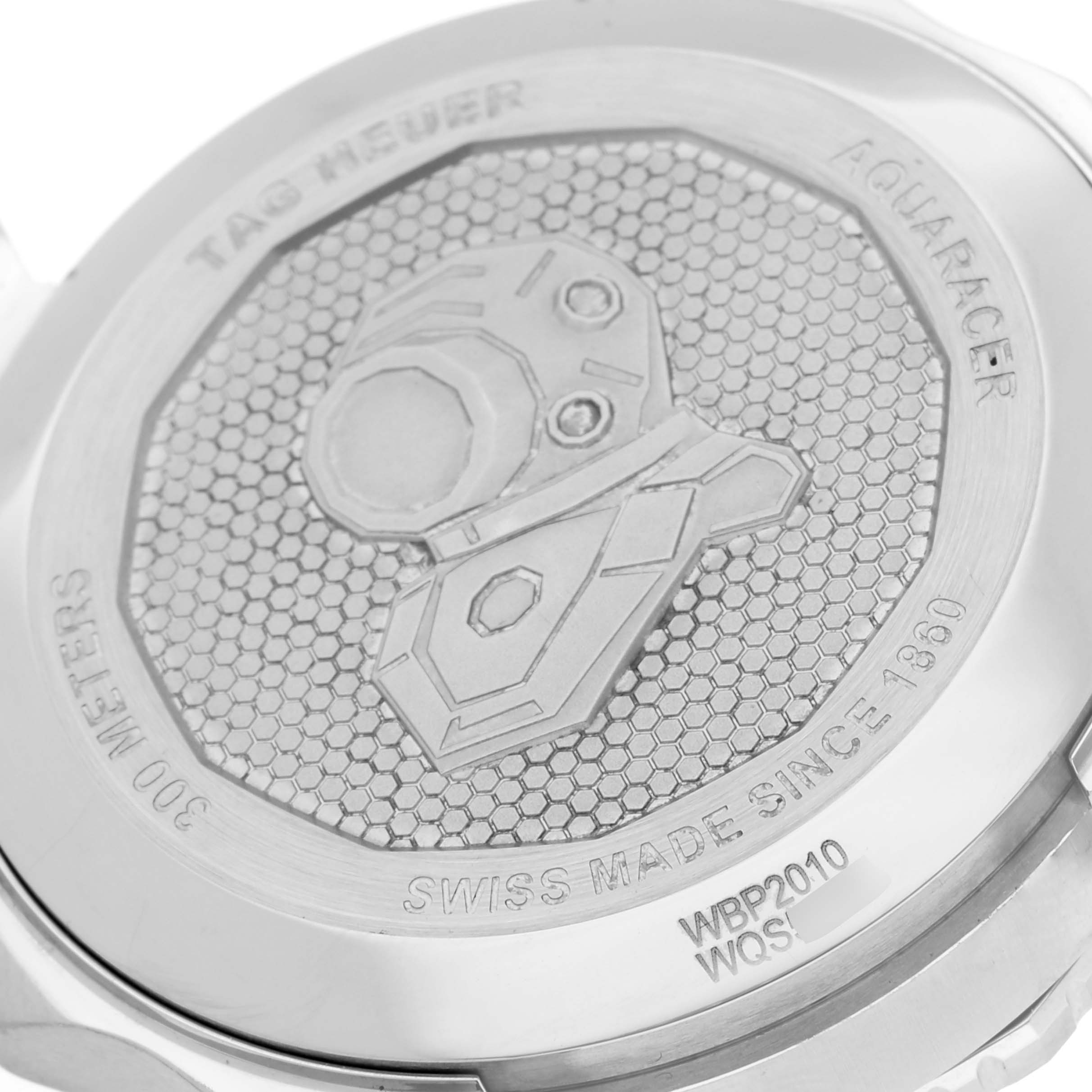 The image shows the back case of a Tag Heuer Aquaracer WBP2010.BA0632 Men's Stainless Steel Blue Dial WBP2010.BA0632 Men's Stainless Steel Blue Dial watch, highlighting the engraved design and branding details.