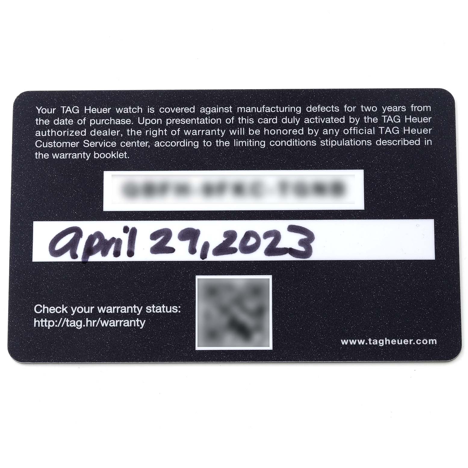 The image shows a warranty card for a Tag Heuer Aquaracer WBP2010.BA0632 Men's Stainless Steel Blue Dial WBP2010.BA0632 Men's Stainless Steel Blue Dial watch, taken from a top-down angle.