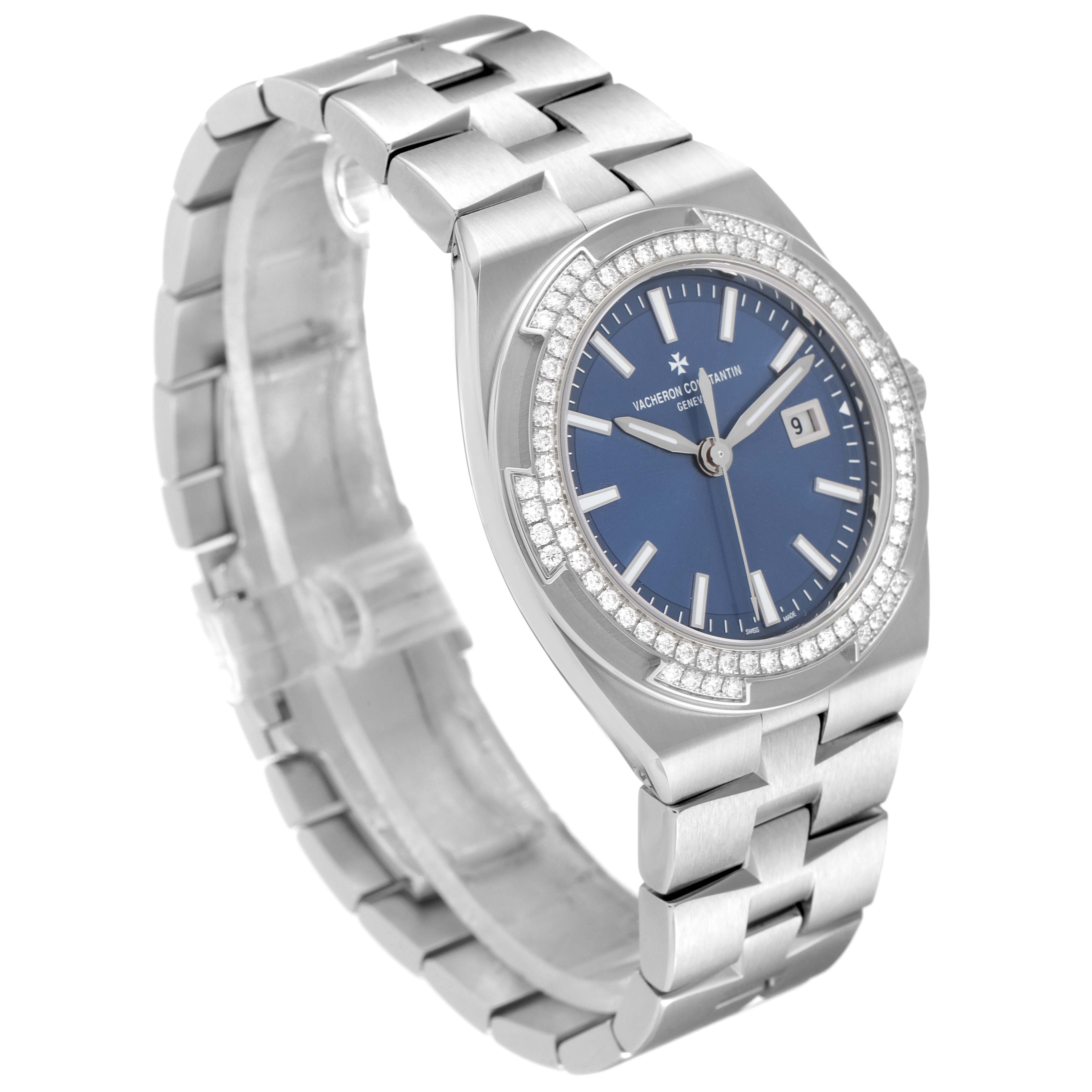 The Vacheron Constantin Overseas 1205V/100A-B590 Women's Stainless Steel Blue Dial model is shown at a three-quarter angle, displaying the bezel, blue dial, and metal bracelet.