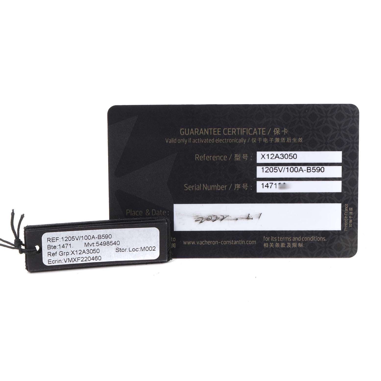 The image shows a guarantee certificate and reference tag for the Vacheron Constantin Overseas 1205V/100A-B590 Women's Stainless Steel Blue Dial model, displaying reference and serial numbers.