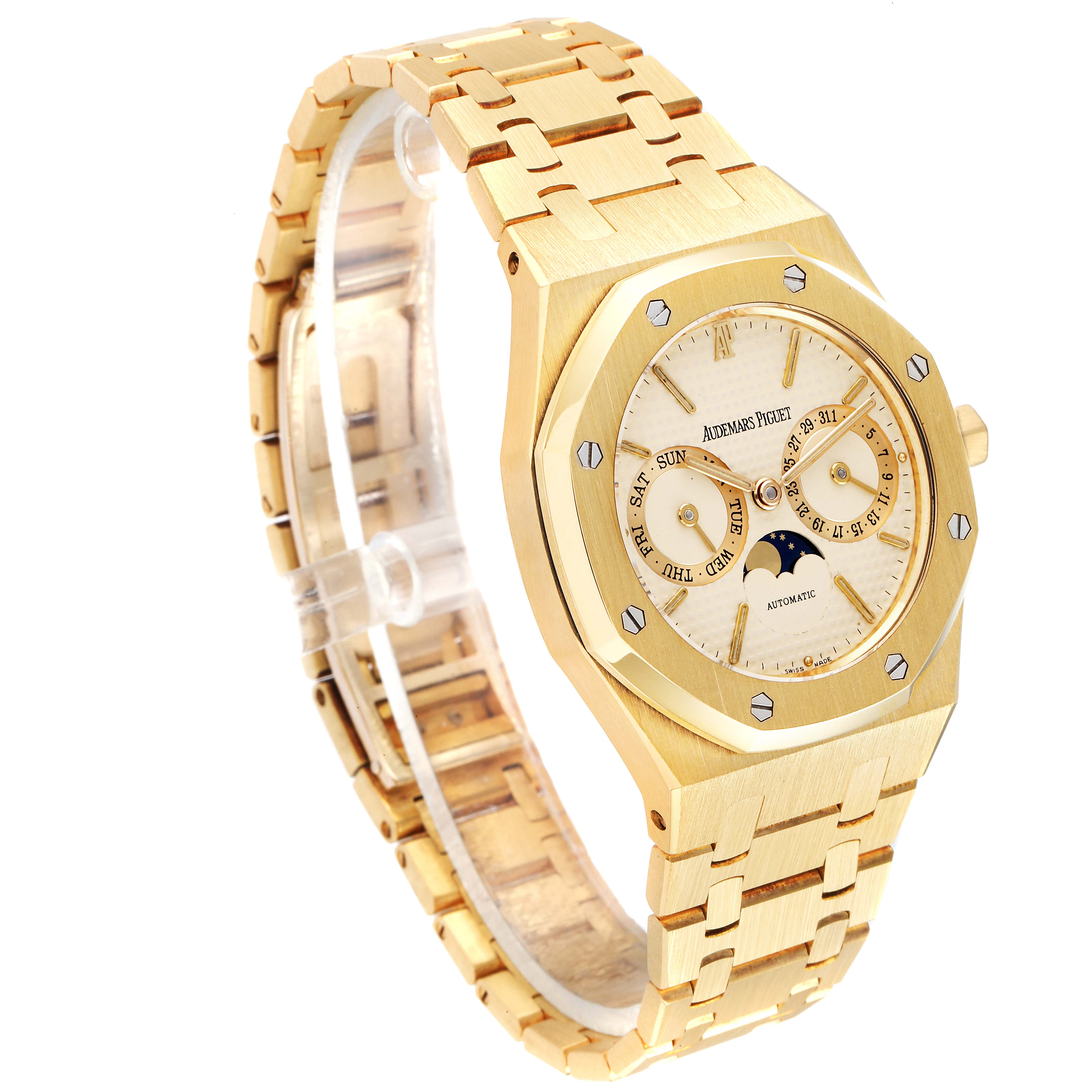 The image shows an angled view of an Audemars Piguet Royal Oak 25594BA.OO.0477BA.01 Men's Yellow Gold Champagne Dial 25594BA.OO.0477BA.01 Men's Yellow Gold Champagne Dial watch, highlighting its gold case, bracelet, and dial with complications.