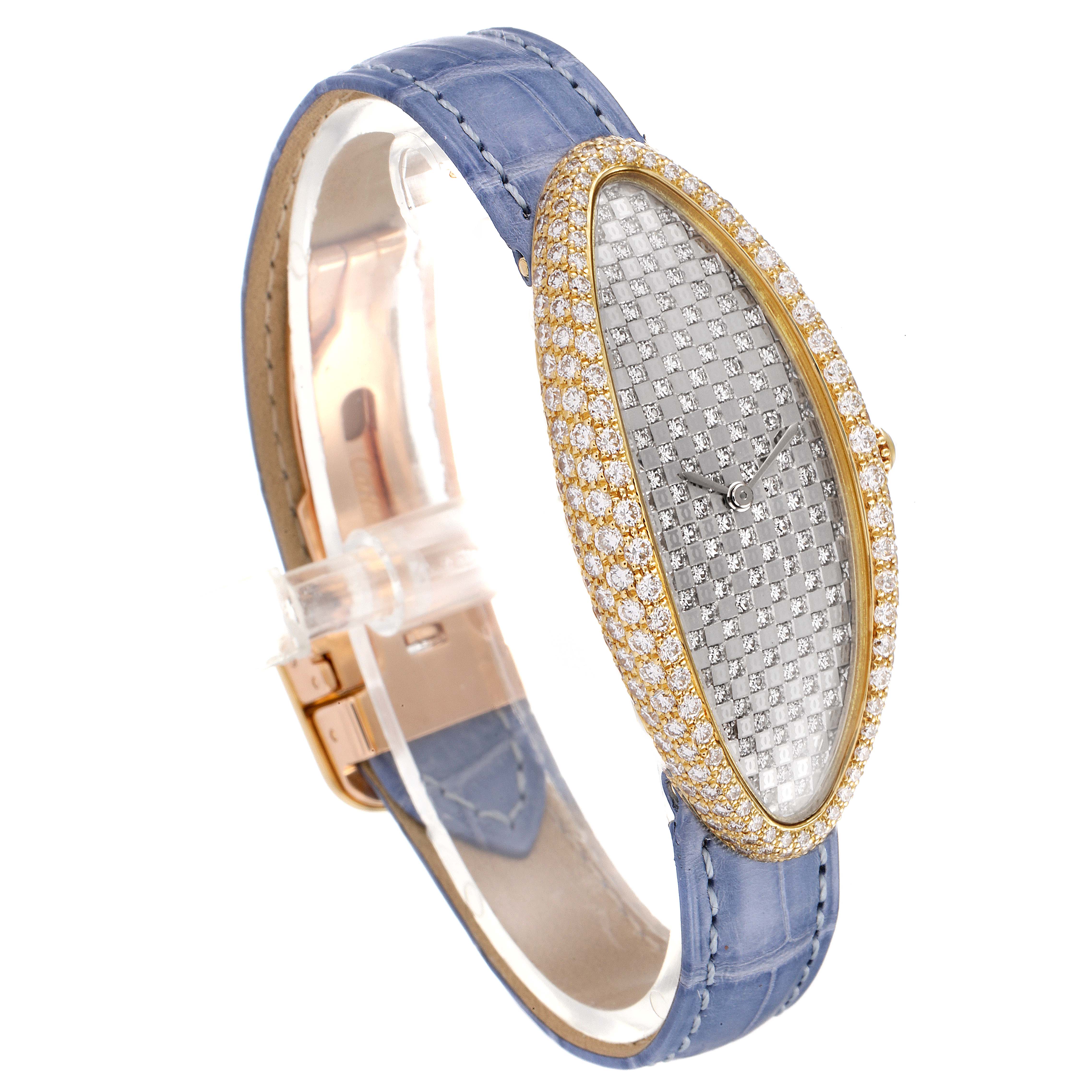 The Cartier Baignoire 2583 Women's Yellow Gold Silver Dial 2583 Women's Yellow Gold Silver Dial watch is shown at an angle highlighting its oval dial, diamond-studded bezel, and blue leather strap.