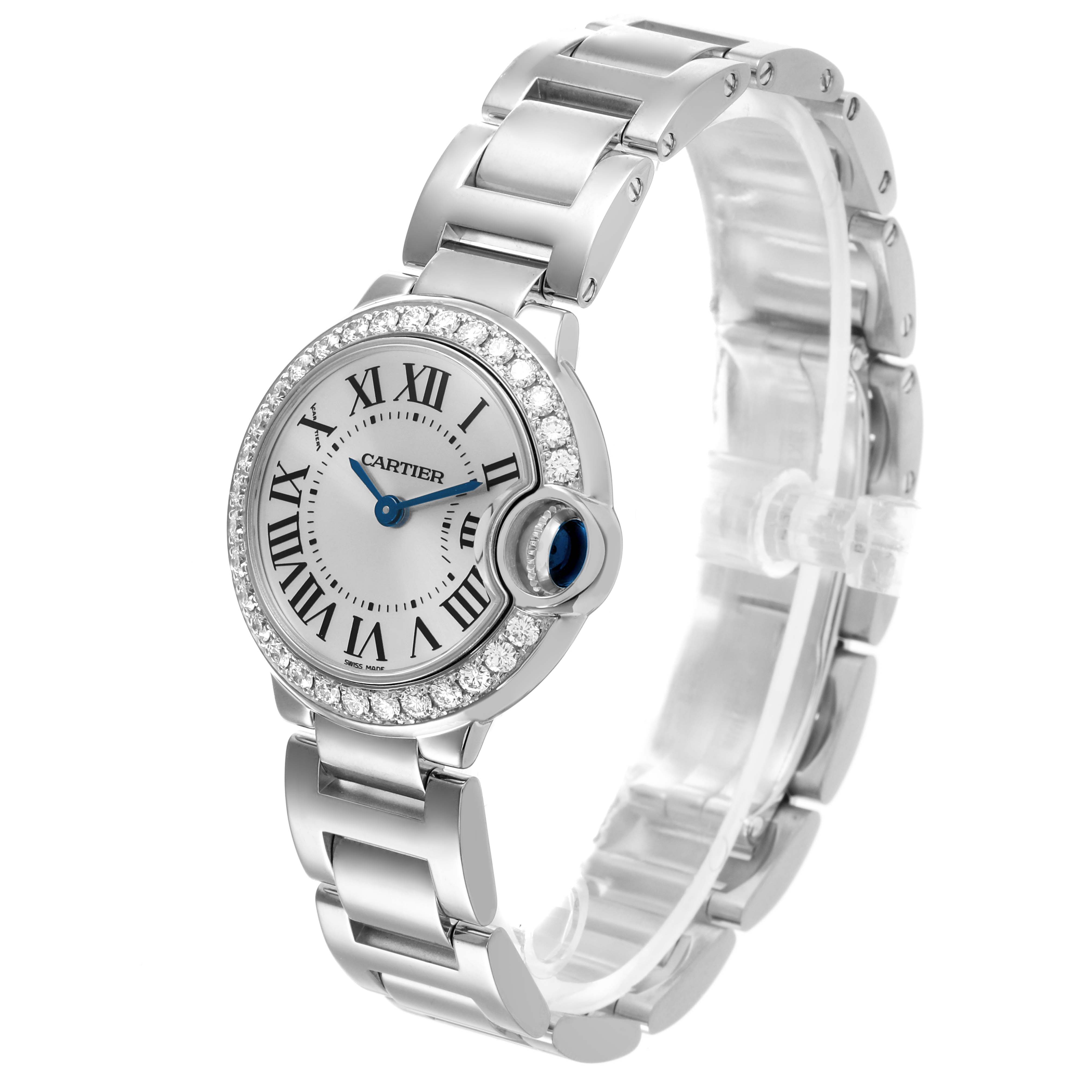 The Ballon Bleu by Cartier is shown at a slight side angle, displaying the watch face, bracelet, and blue cabochon crown.