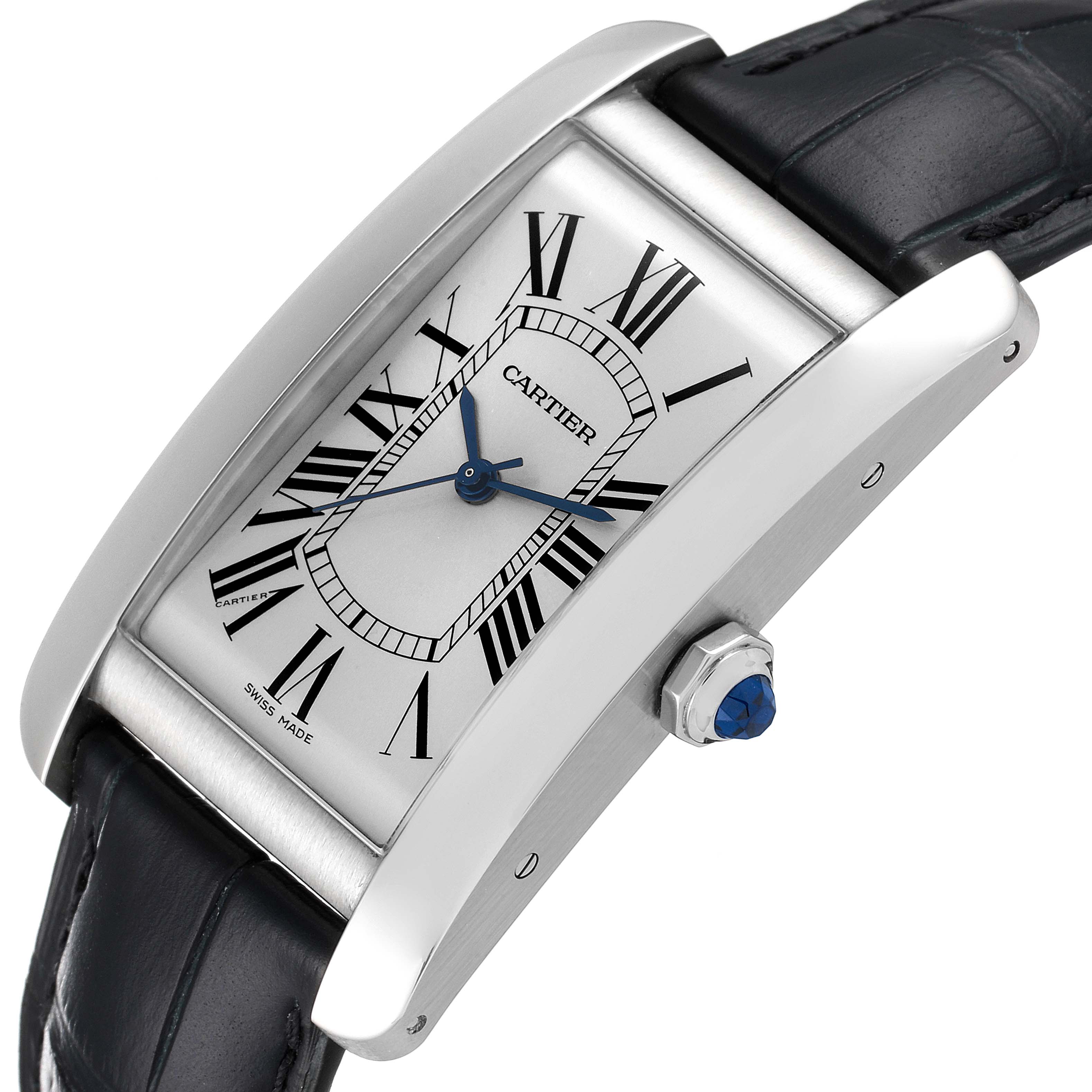 The Cartier Tank Americaine WSTA0018 Men
s Stainless Steel Silver Dial WSTA0018 Men
s Stainless Steel Silver Dial watch is shown at an angled view, highlighting its dial, blue hands, crown, and black leather strap.