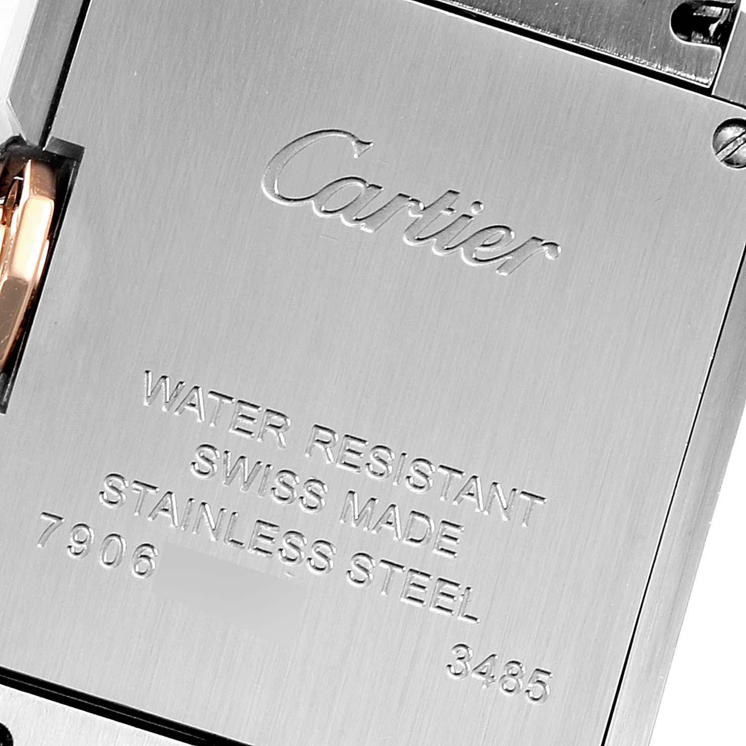 The image shows the back case of a Cartier Tank Anglaise WT100024 Women's Steel and Gold (two tone) Silver Dial WT100024 Women's Steel and Gold (two tone) Silver Dial watch, featuring engraving details.