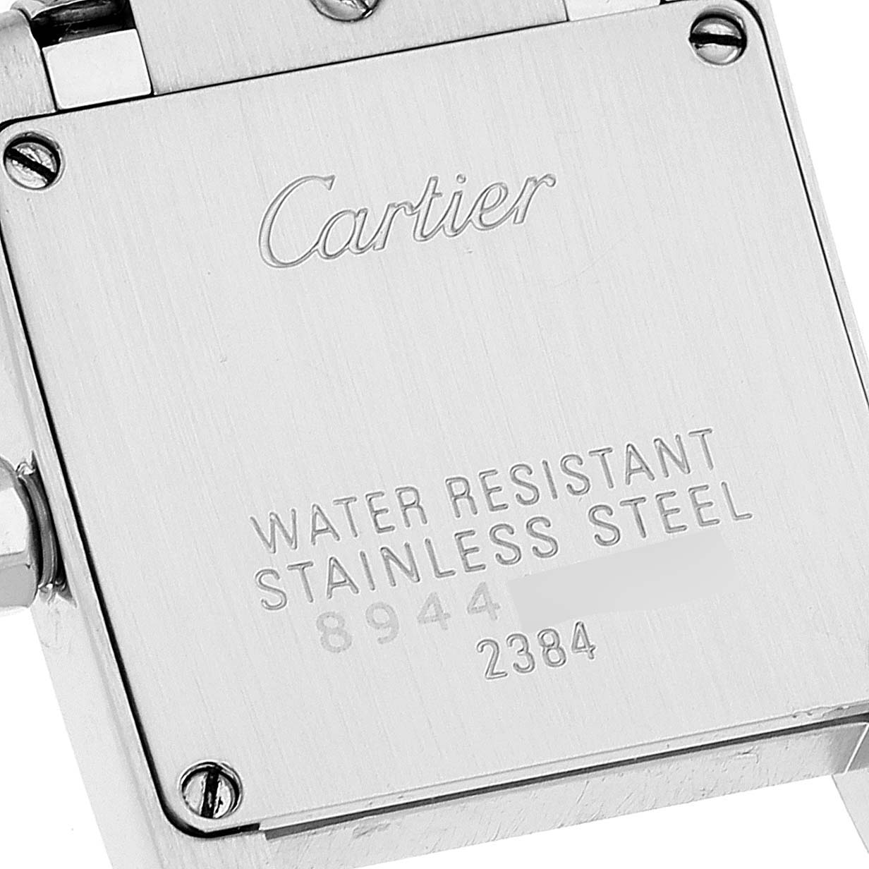 This image shows the back of a Tank Française watch by Cartier, highlighting its stainless steel and water-resistant features.