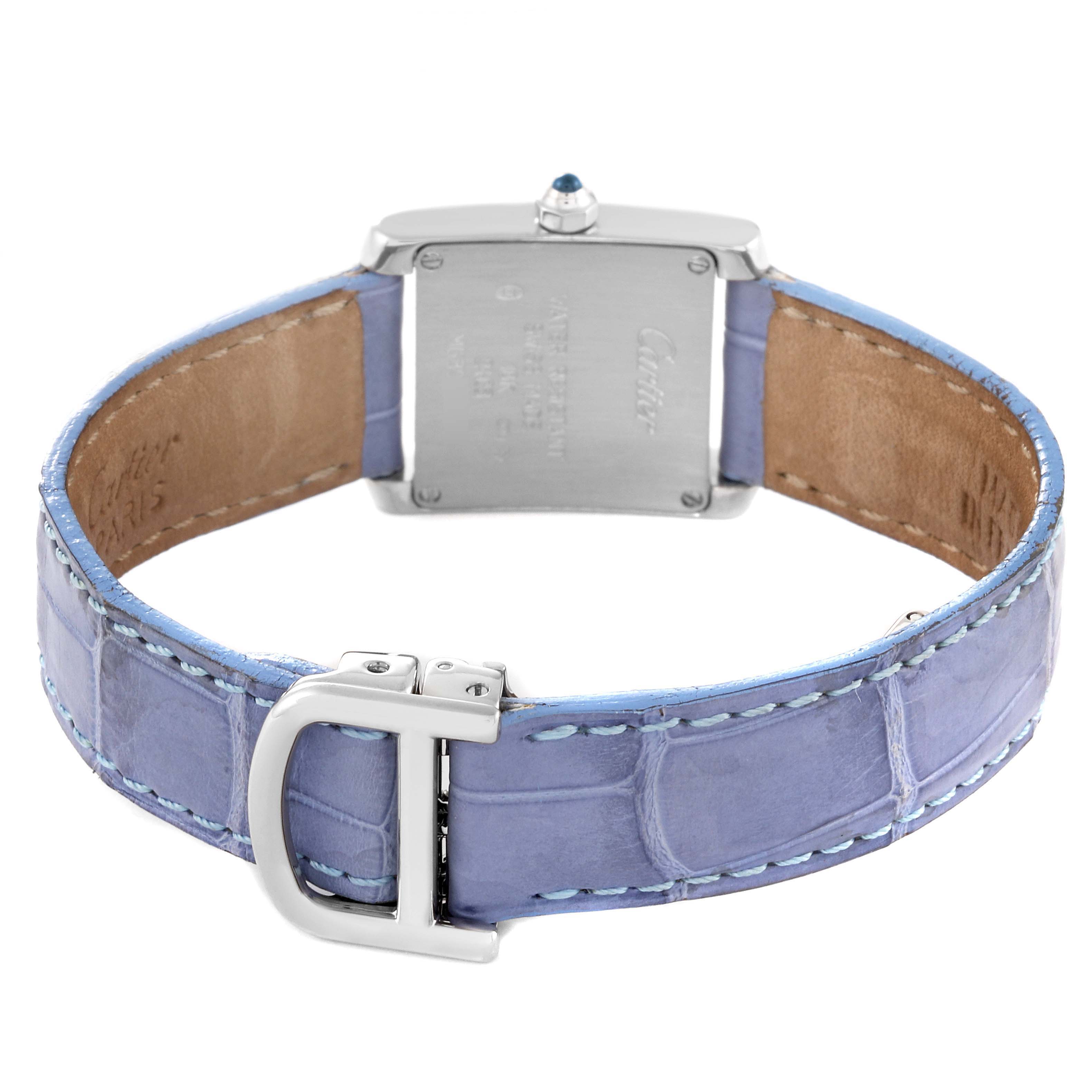 The image shows the back view of a Cartier Tank Française watch, highlighting its case back, crown, and leather strap.