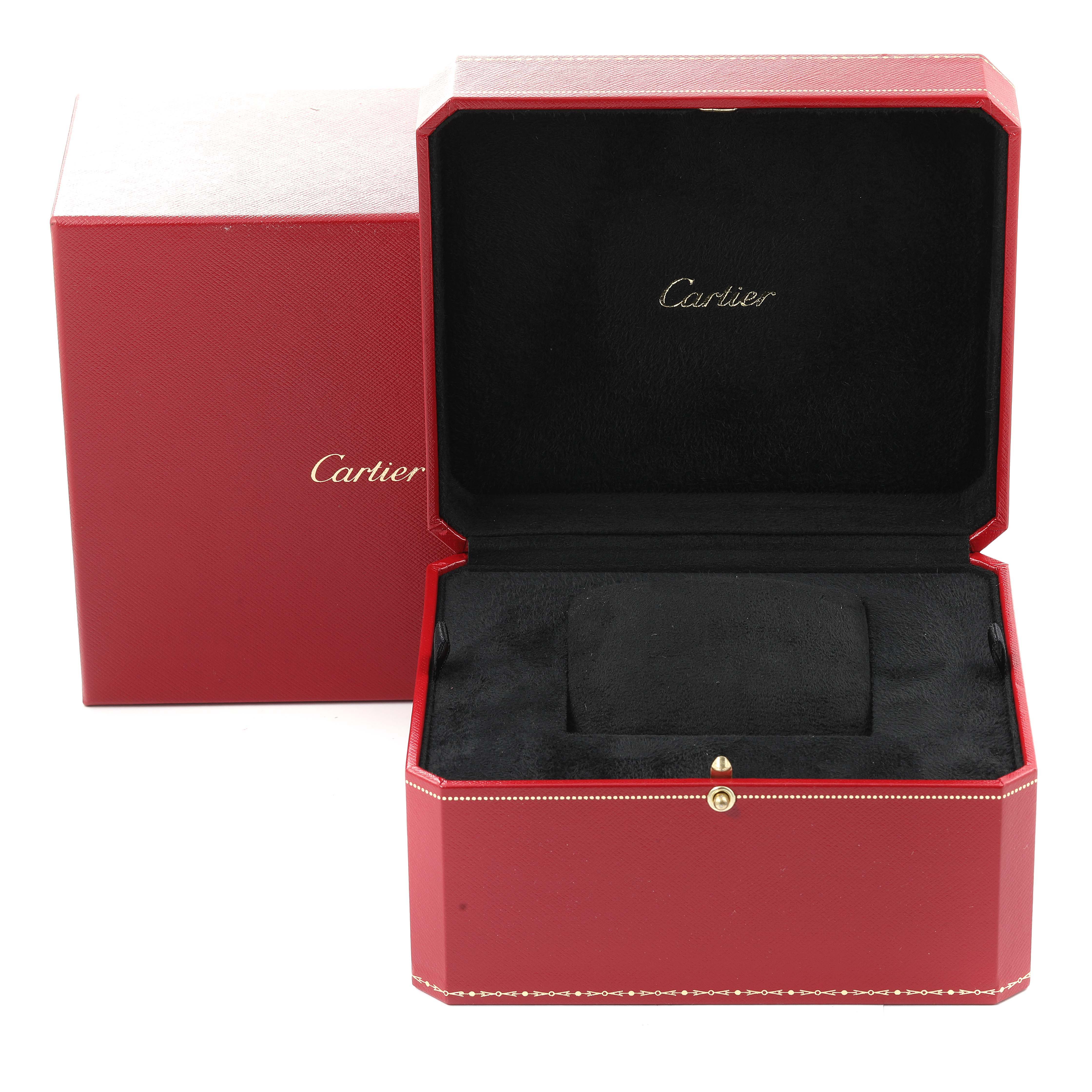 The image shows an open red Cartier box for a Tank MC model watch, displaying the interior cushion.