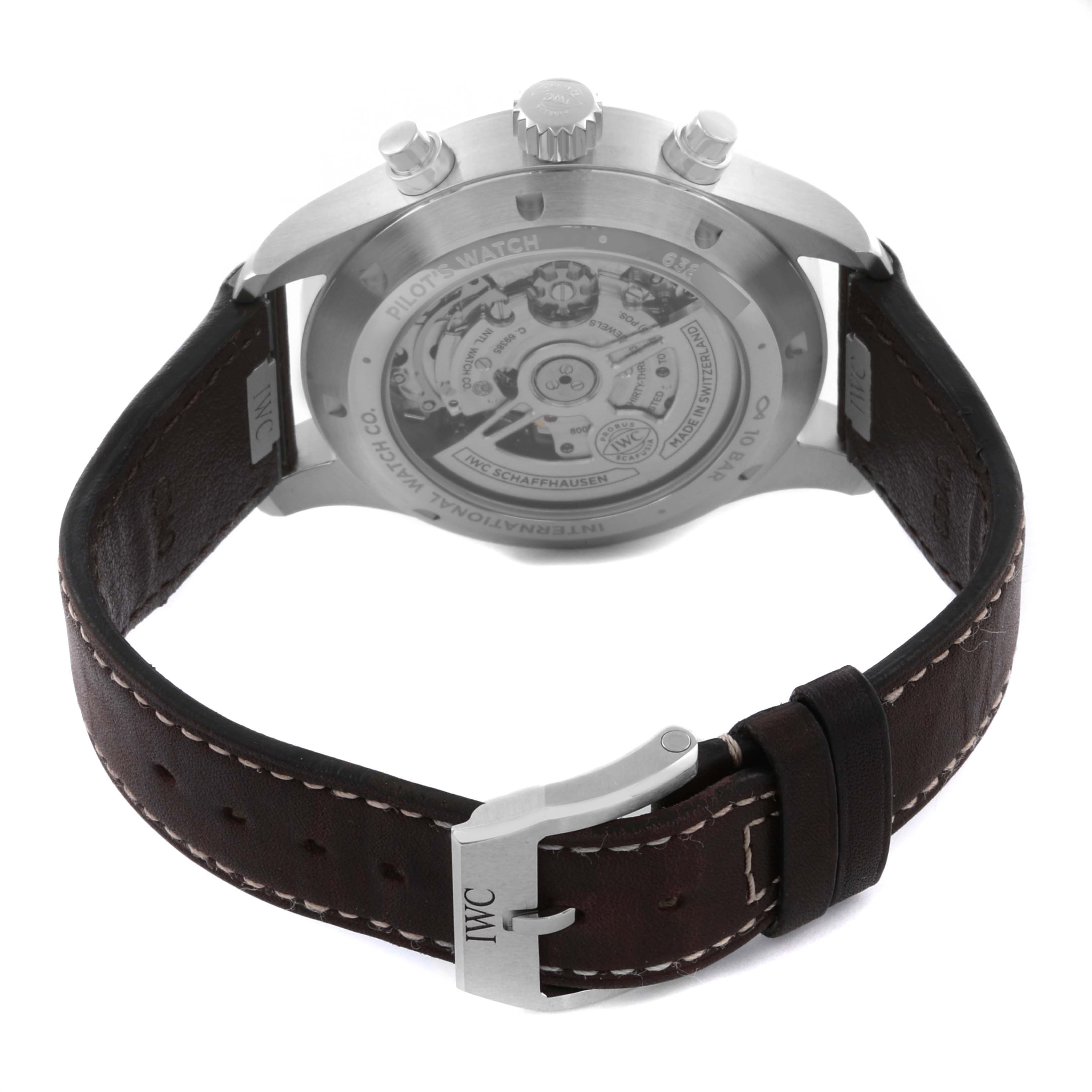 The IWC Pilot IW378005 Men's Stainless Steel Green Dial IW378005 Men's Stainless Steel Green Dial watch is shown from the back, highlighting the transparent case back and leather strap.