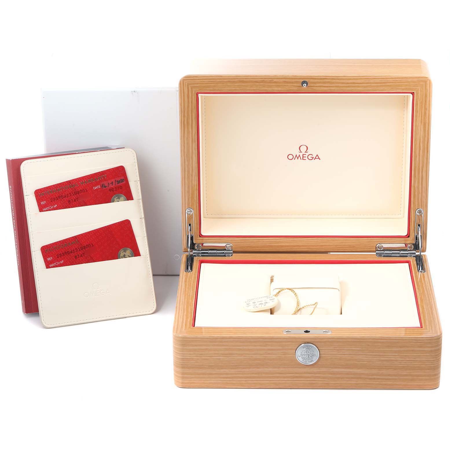 Top view of an Omega Seamaster 233.90.41.21.03.001 Men's Titanium Blue Dial 233.90.41.21.03.001 Men's Titanium Blue Dial watch box and accessories, including warranty cards in a holder.