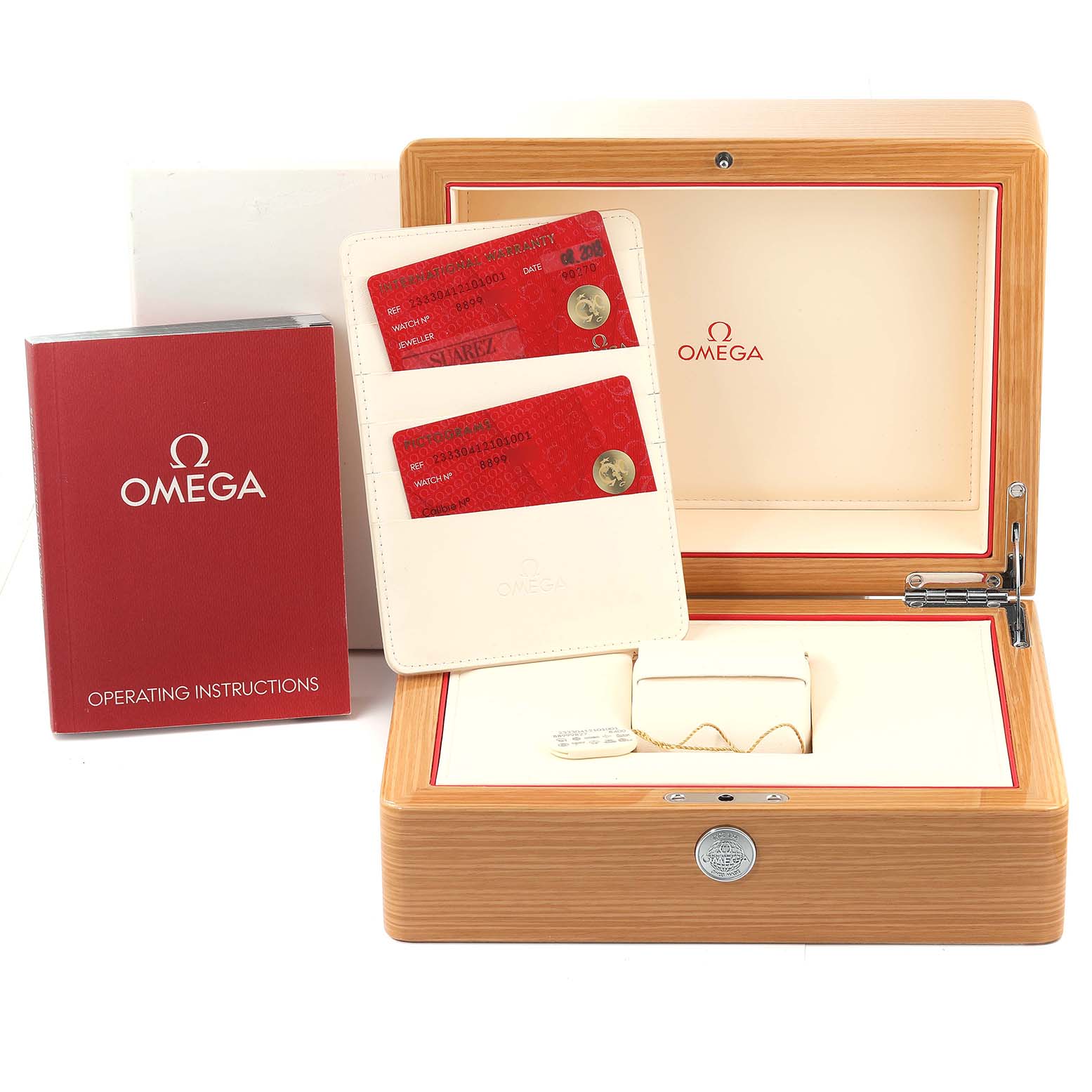 This image shows the packaging and accessories of the Omega Seamaster 233.30.41.21.01.001 Men's Stainless Steel Black Dial 233.30.41.21.01.001 Men's Stainless Steel Black Dial watch, including the box, cards, and operating manual.