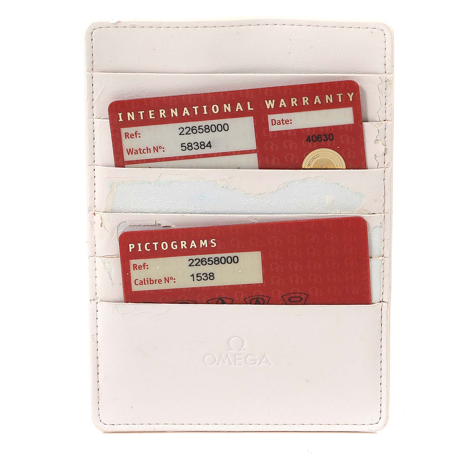 This image shows Omega Seamaster 2265.80.00 Men's Stainless Steel Blue Dial 2265.80.00 Men's Stainless Steel Blue Dial model's warranty and pictograms cards in a white cardholder.