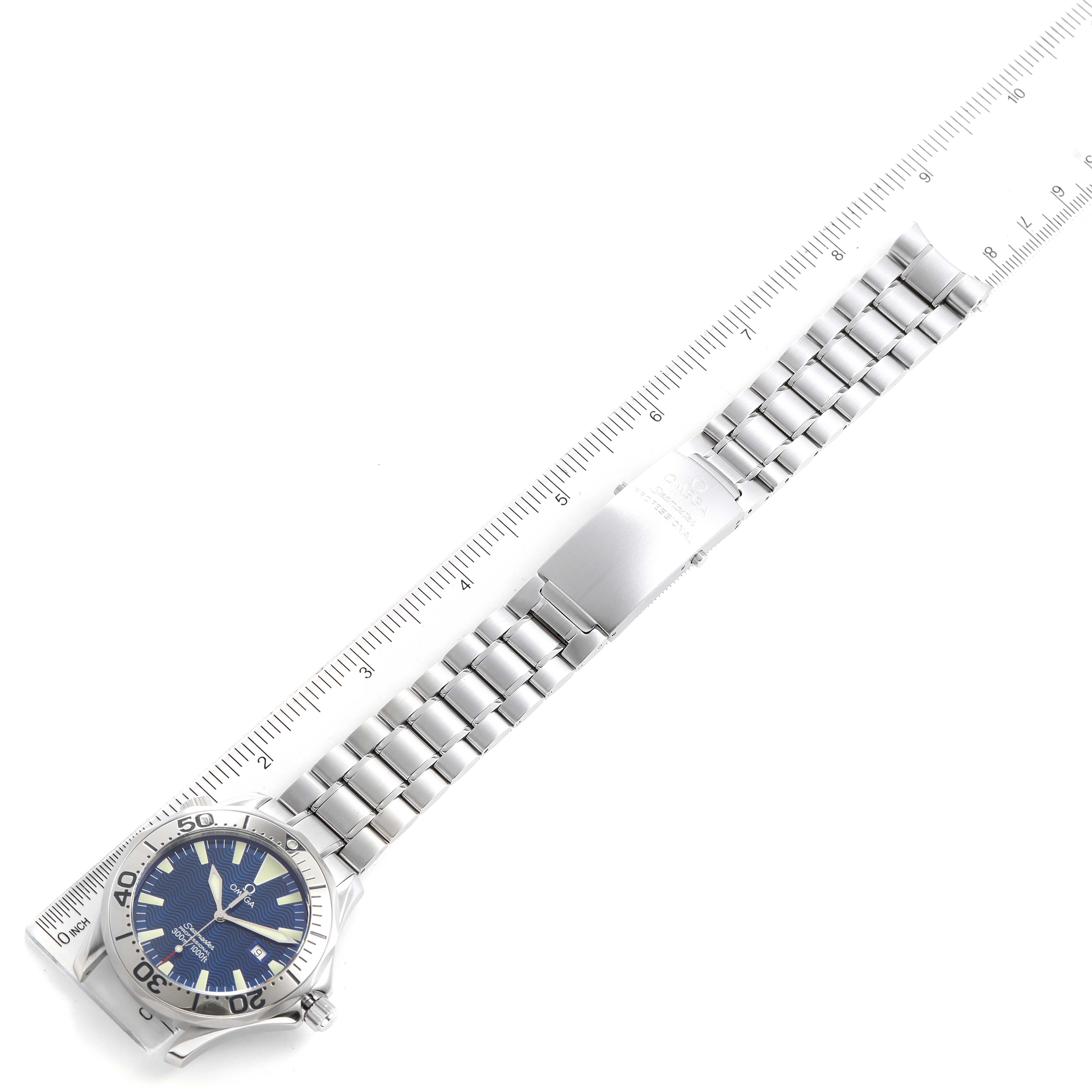 The image shows a top-down view of an Omega Seamaster 2265.80.00 Men's Stainless Steel Blue Dial 2265.80.00 Men's Stainless Steel Blue Dial watch with its face, bezel, and metal bracelet fully visible alongside a ruler.