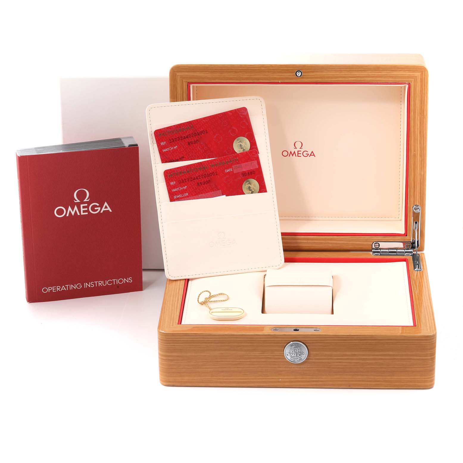 The image shows a wooden Omega Planet Ocean 232.32.44.22.01.001 Men
s Stainless Steel Black Dial 232.32.44.22.01.001 Men
s Stainless Steel Black Dial watch box, operating instructions, warranty cards, and a watch cushion.