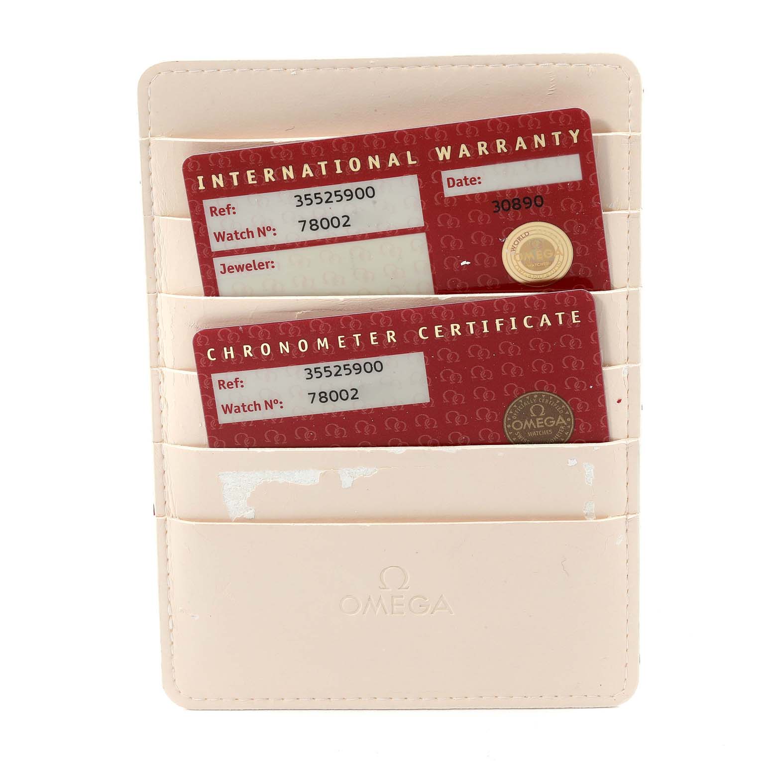 The image shows the warranty and chronometer certificate cards for an Omega Speedmaster 3552.59.00 Men's Stainless Steel Black Dial 3552.59.00 Men's Stainless Steel Black Dial watch in a beige cardholder.