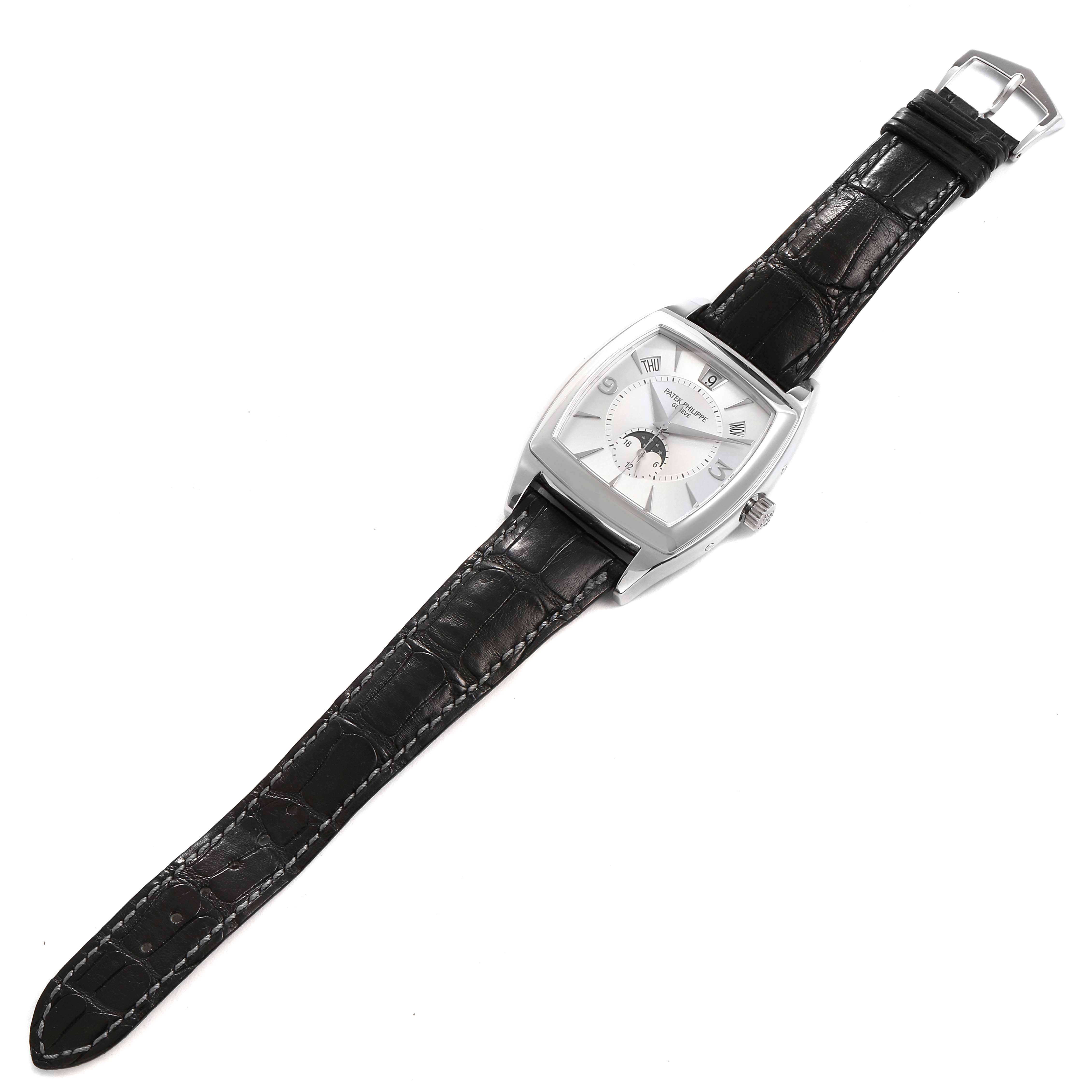 The Patek Philippe Gondolo 5135G Men's White Gold Silver Dial 5135G Men's White Gold Silver Dial watch is shown from a slightly oblique top view, displaying its dial and black leather strap.