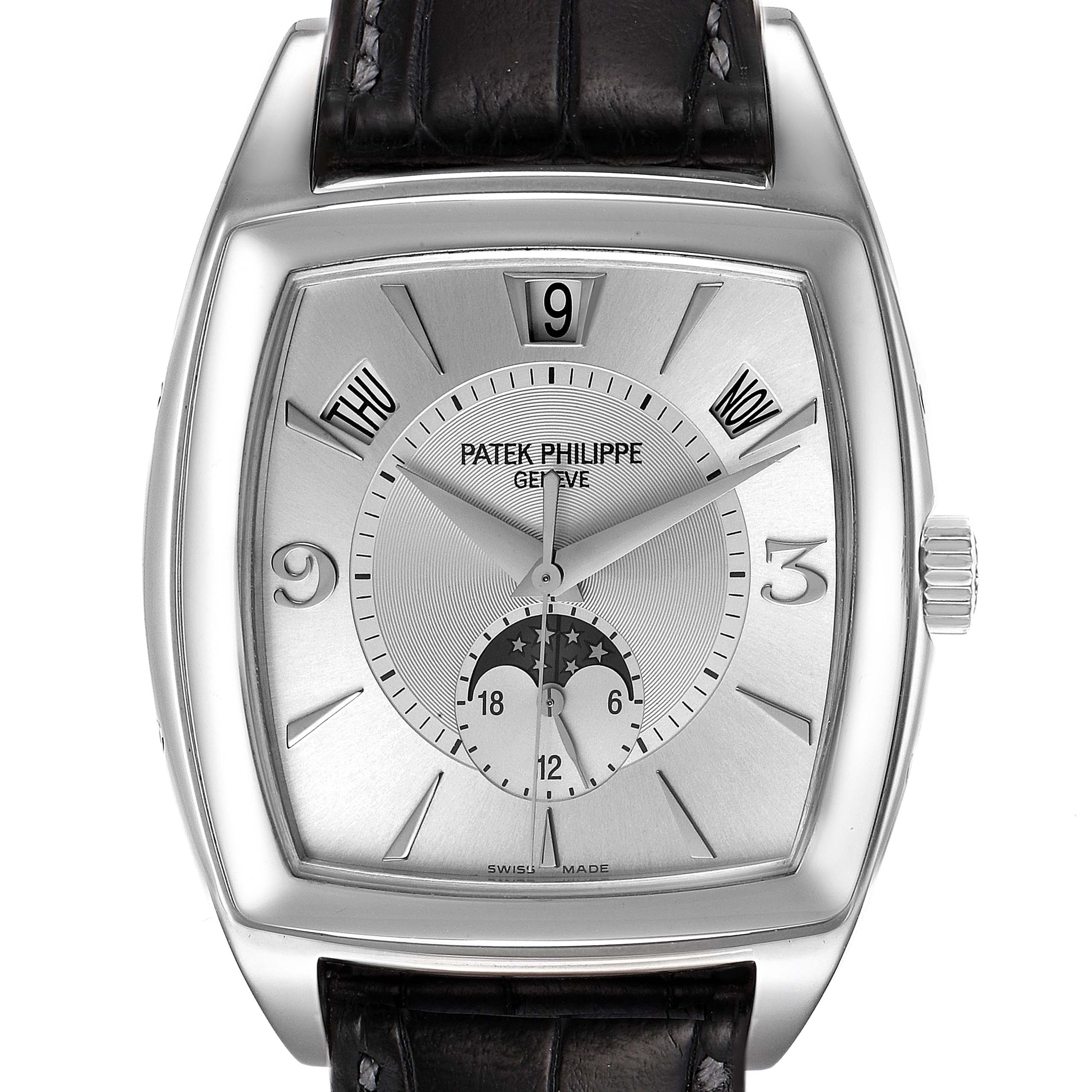 The image shows the face of a Patek Philippe Gondolo 5135G Men's White Gold Silver Dial 5135G Men's White Gold Silver Dial watch, displaying the time, day, month, and a moonphase indicator.