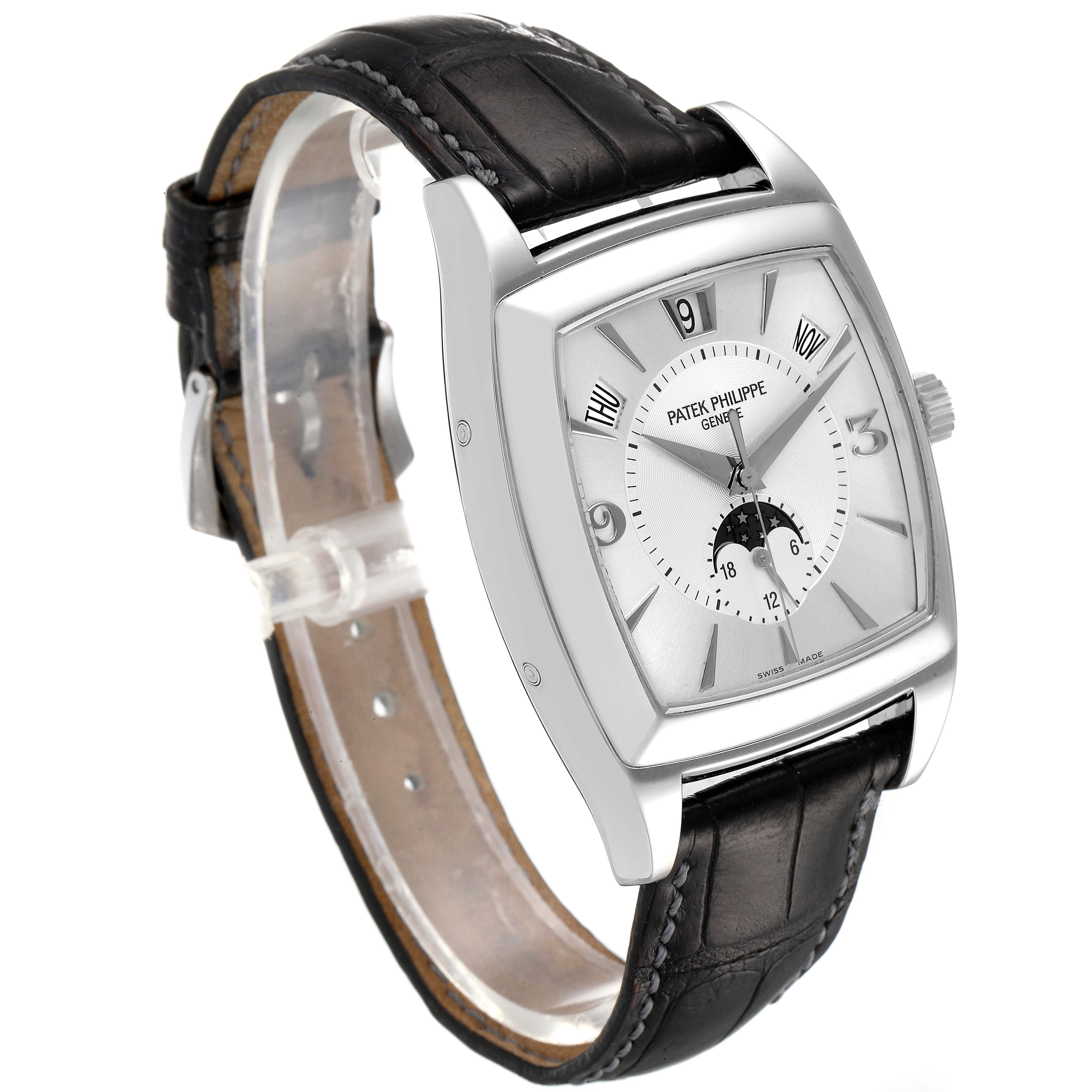 The Patek Philippe Gondolo 5135G Men's White Gold Silver Dial 5135G Men's White Gold Silver Dial watch is shown at a slight angle from the front, displaying its dial, case, and black leather strap.