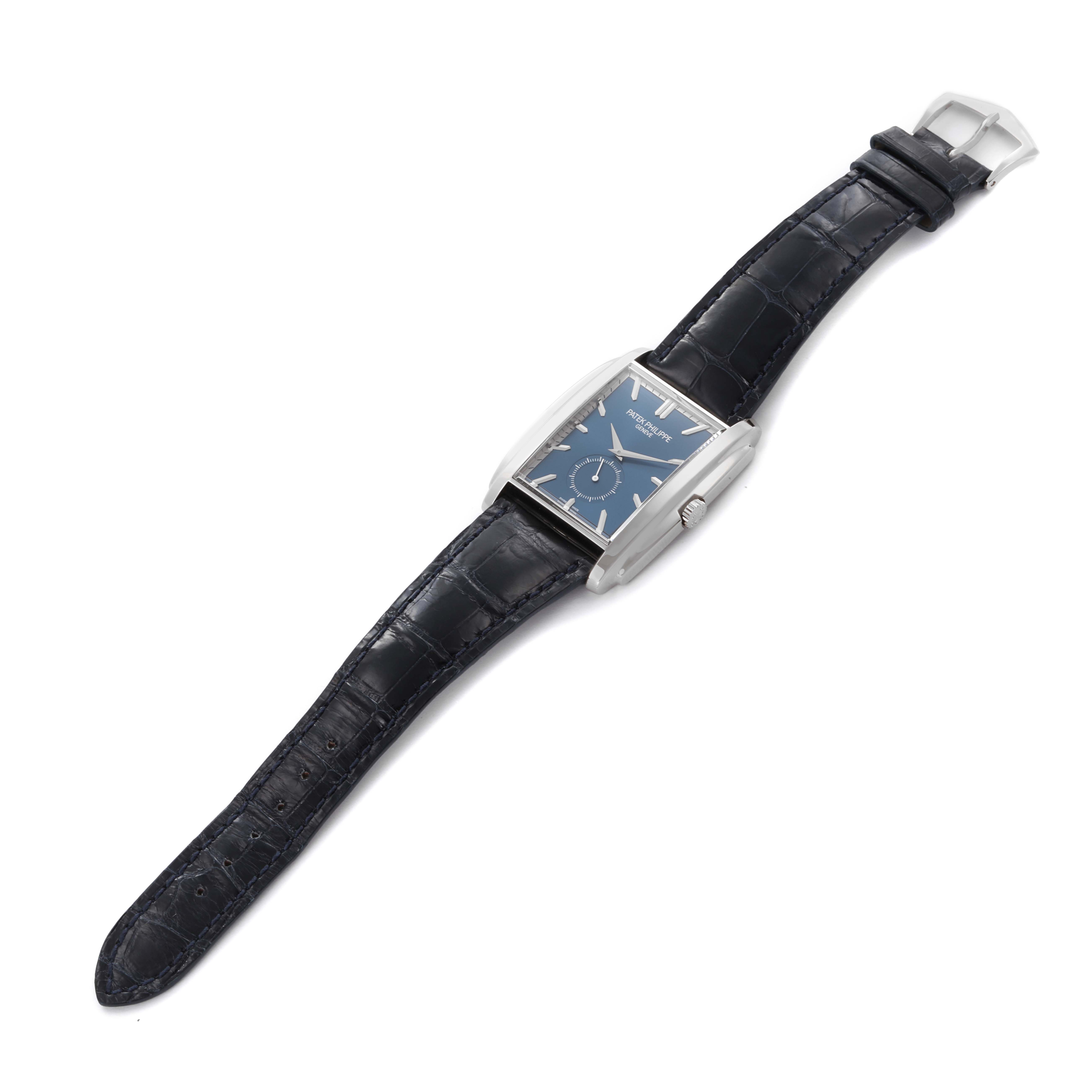 The Patek Philippe Gondolo 5124G-011 Men's White Gold Blue Dial 5124G-011 Men's White Gold Blue Dial watch is shown from an angled top view, displaying the dial, strap, and clasp.