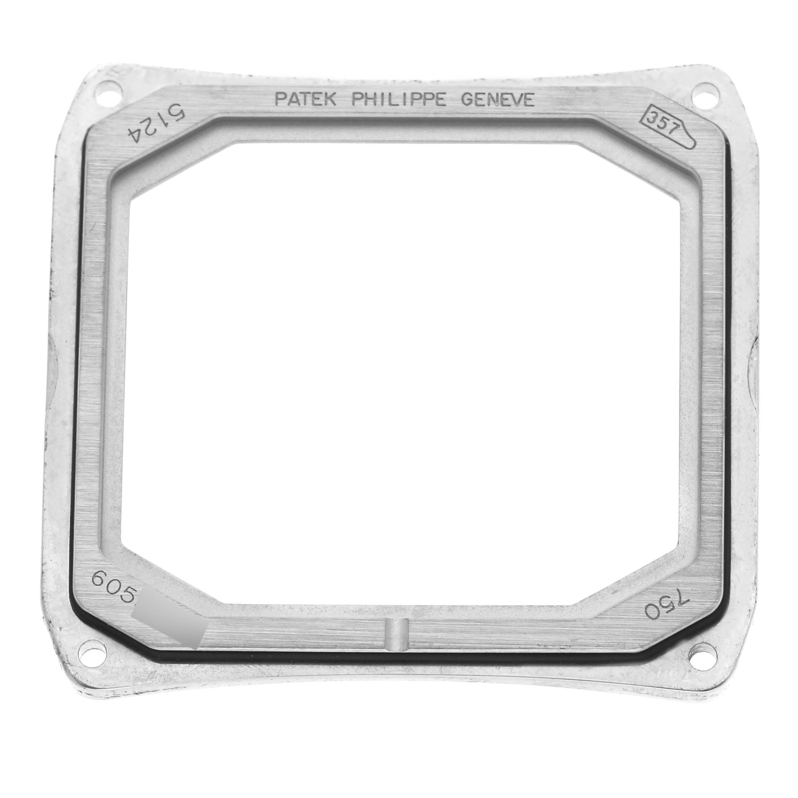 This image shows a rectangular bezel or case component of the Patek Philippe Gondolo 5124G-011 Men's White Gold Blue Dial 5124G-011 Men's White Gold Blue Dial watch from a top-down angle.