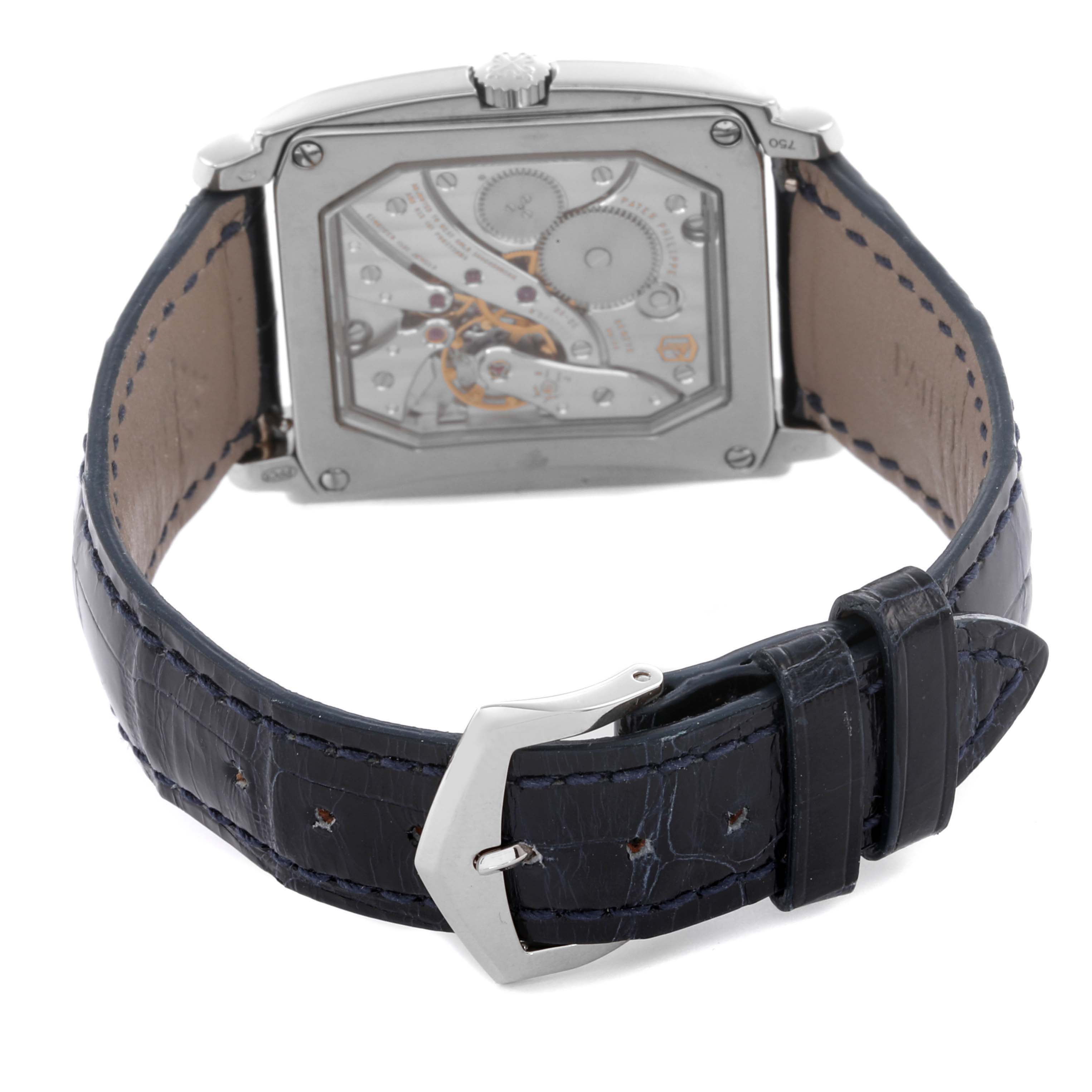 The image shows the back angle of a Patek Philippe Gondolo 5124G-011 Men's White Gold Blue Dial 5124G-011 Men's White Gold Blue Dial watch, highlighting its movement and leather strap with a buckle.