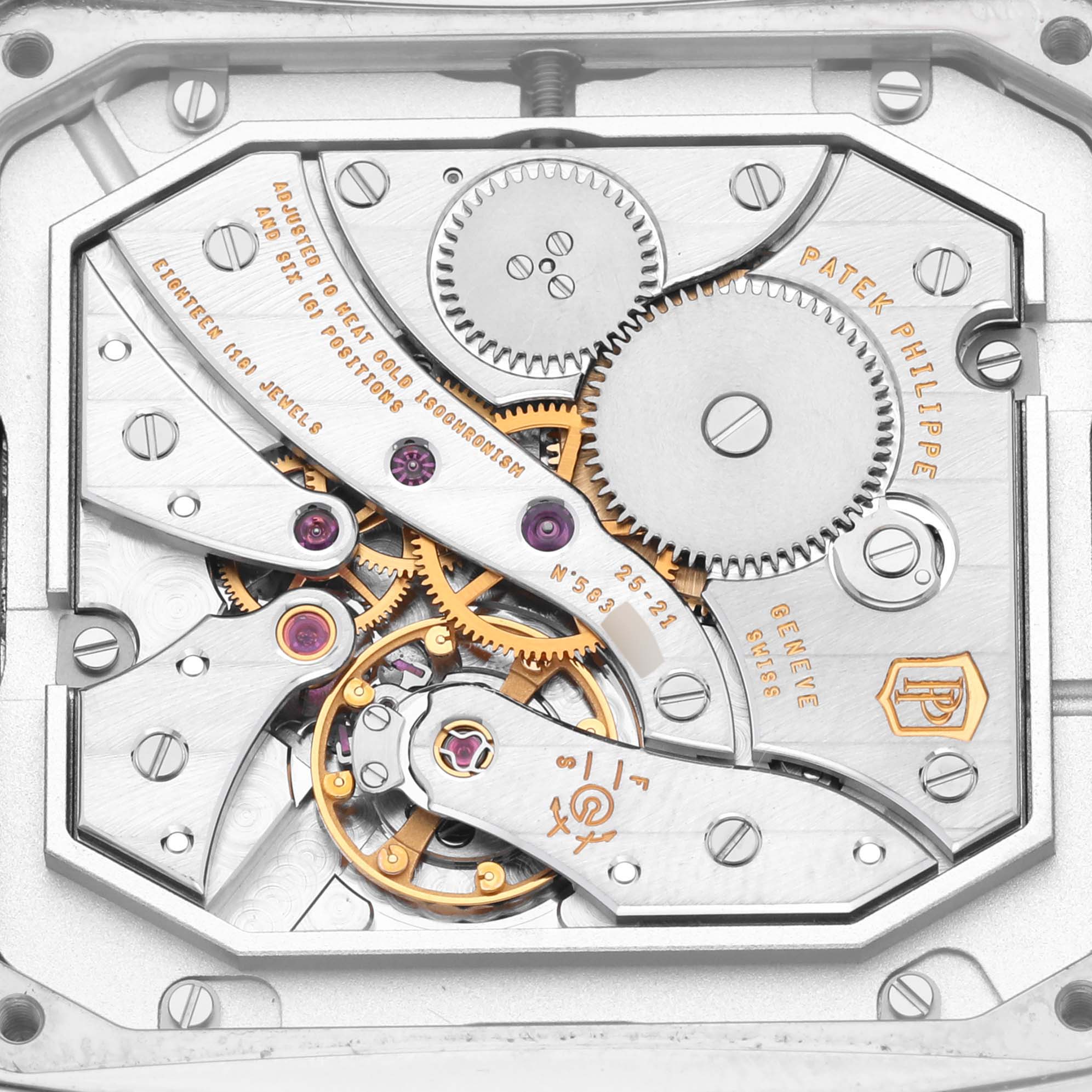 This image shows the intricate movement and gears of a Patek Philippe Gondolo 5124G-011 Men's White Gold Blue Dial 5124G-011 Men's White Gold Blue Dial watch from a top-down angle.