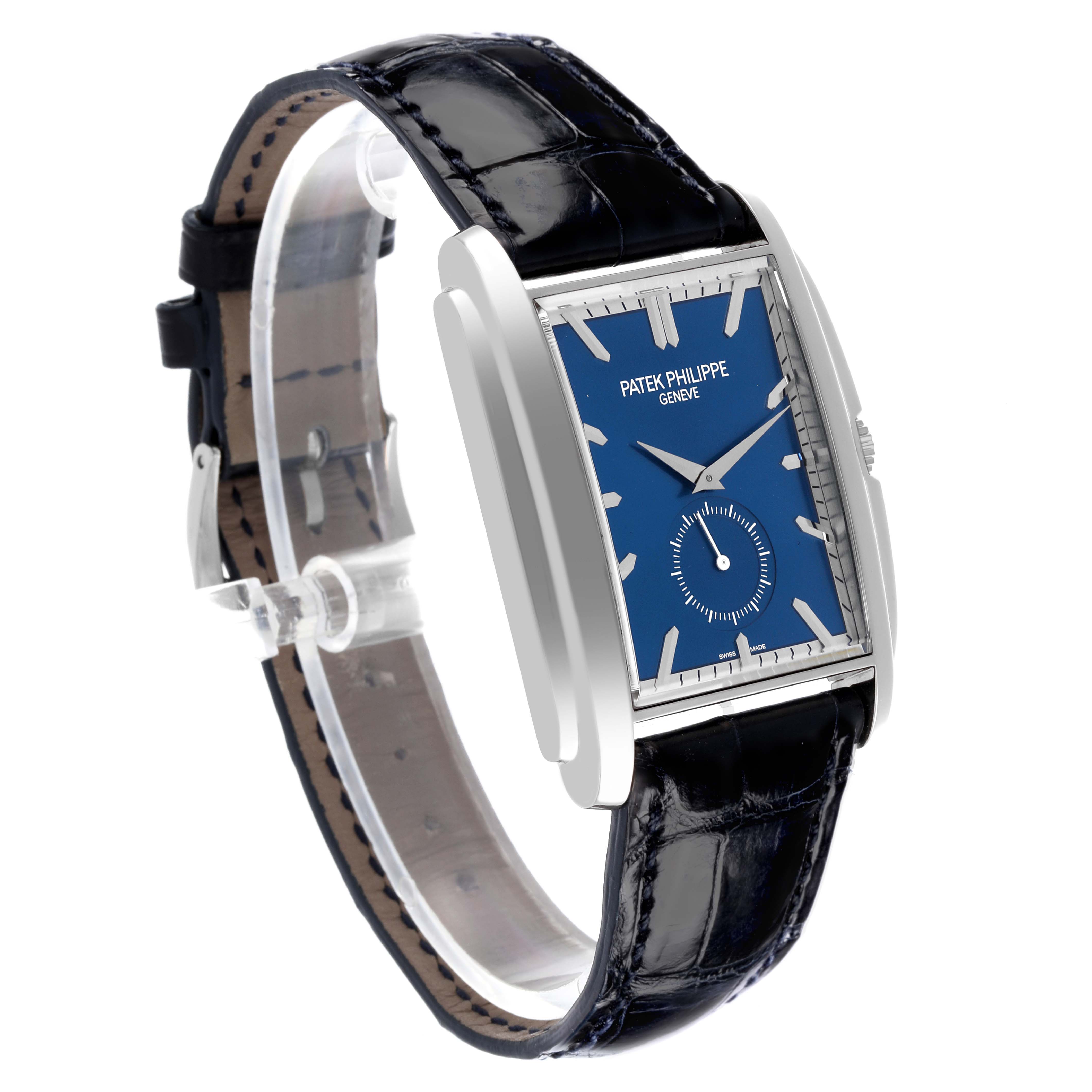The Patek Philippe Gondolo 5124G-011 Men's White Gold Blue Dial 5124G-011 Men's White Gold Blue Dial watch is shown at a slight angle, highlighting its rectangular blue dial and black leather strap.
