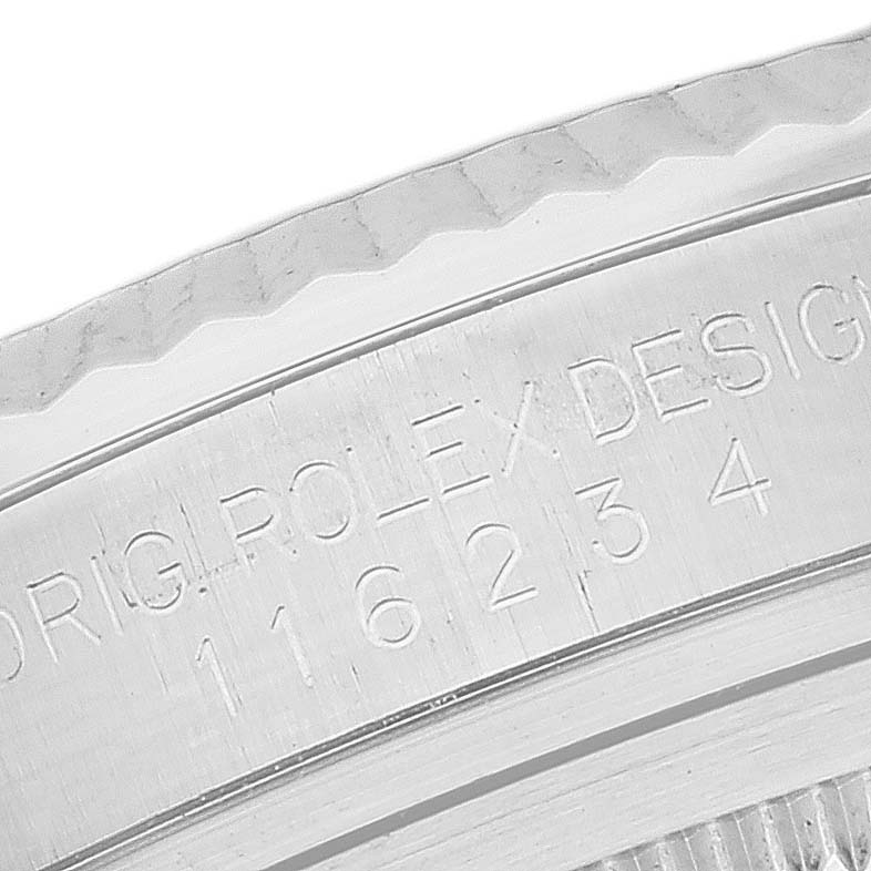 This image shows a close-up of the engraved bezel and reference number on a Rolex Datejust 116234 Men's Stainless Steel Mother of Pearl Dial 116234 Men's Stainless Steel Mother of Pearl Dial watch.