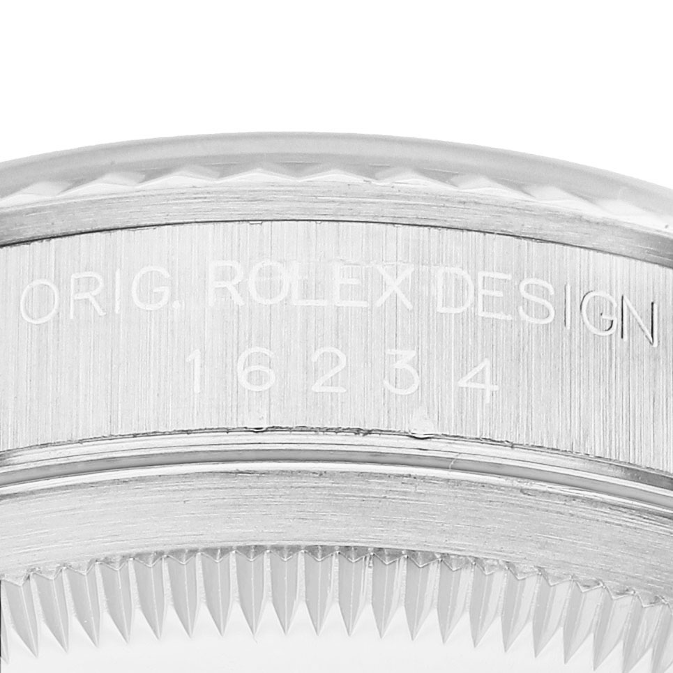 The image shows a close-up of the engraved case side for a Rolex Datejust 16234 Men's Stainless Steel Silver Dial, displaying the model number and detailing.