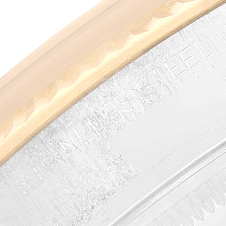 This image shows a close-up of the bezel and part of the case-back of the Rolex Vintage Collection 16013 Men's Steel and Gold (two tone) Black Dial 16013 Men's Steel and Gold (two tone) Black Dial model watch.