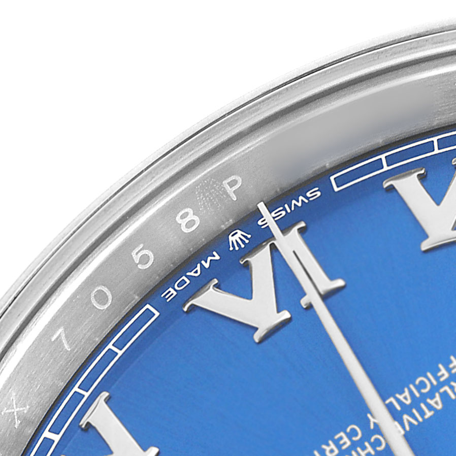 The image shows a close-up of the Rolex Datejust 41 126300 Men's Stainless Steel Blue Dial, highlighting the bezel, part of the blue dial, and Roman numeral markers.