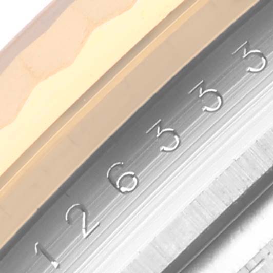 The image shows a close-up of the Rolex Datejust bezel and edge of the dial from a side angle.