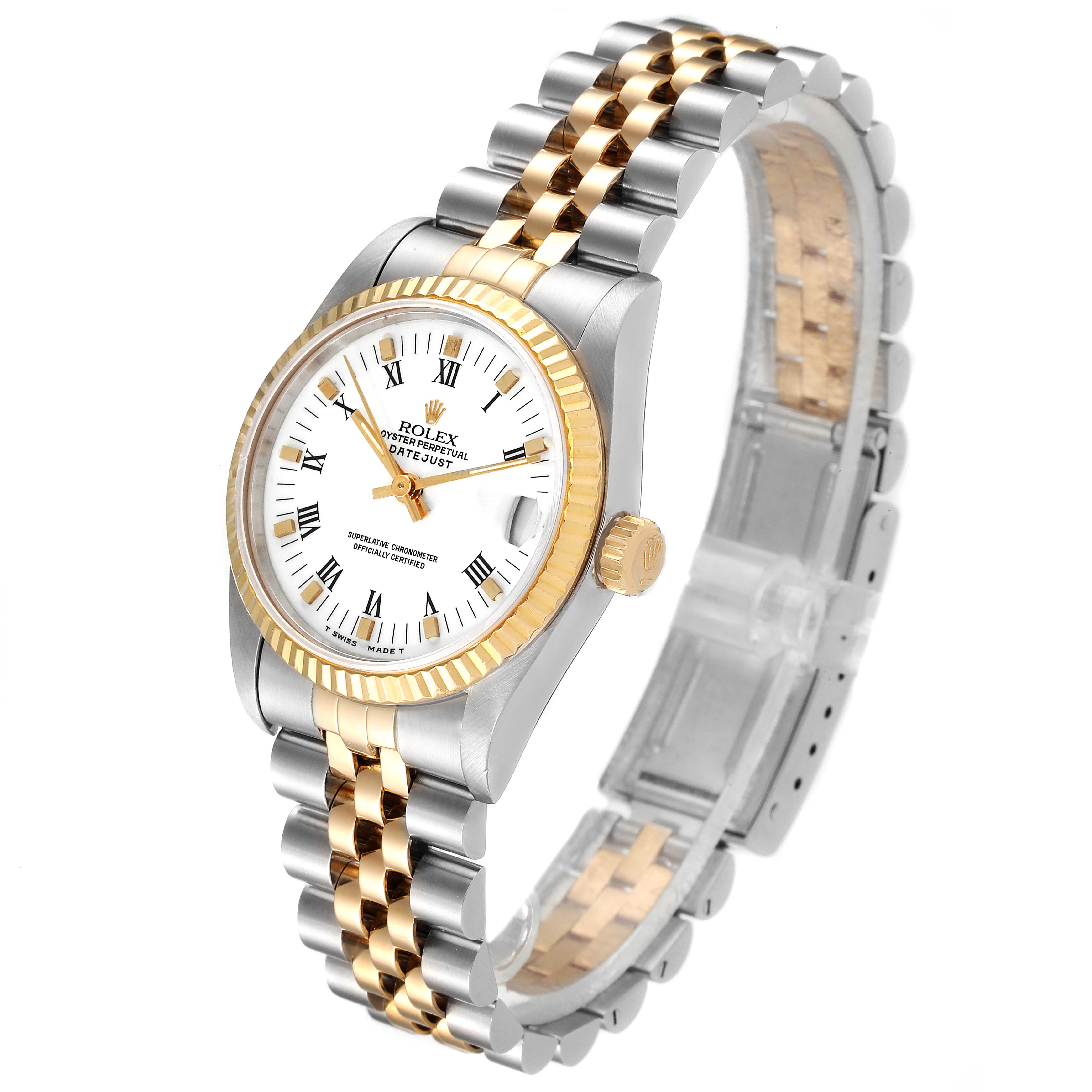 The image shows a Rolex Mid-Size 68273 Women's Steel and Gold (two tone) White Dial 68273 Women's Steel and Gold (two tone) White Dial Datejust watch angled to showcase its white dial, gold fluted bezel, and two-tone jubilee bracelet.