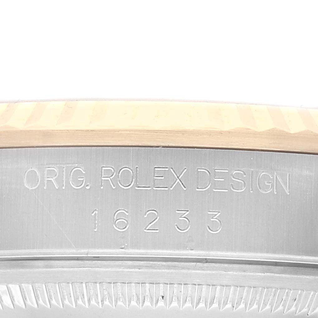 The image shows a close-up of the engraved casing of the Rolex Datejust 16233 Men's Steel and Gold (two tone) Champagne Dial 16233 Men's Steel and Gold (two tone) Champagne Dial model.