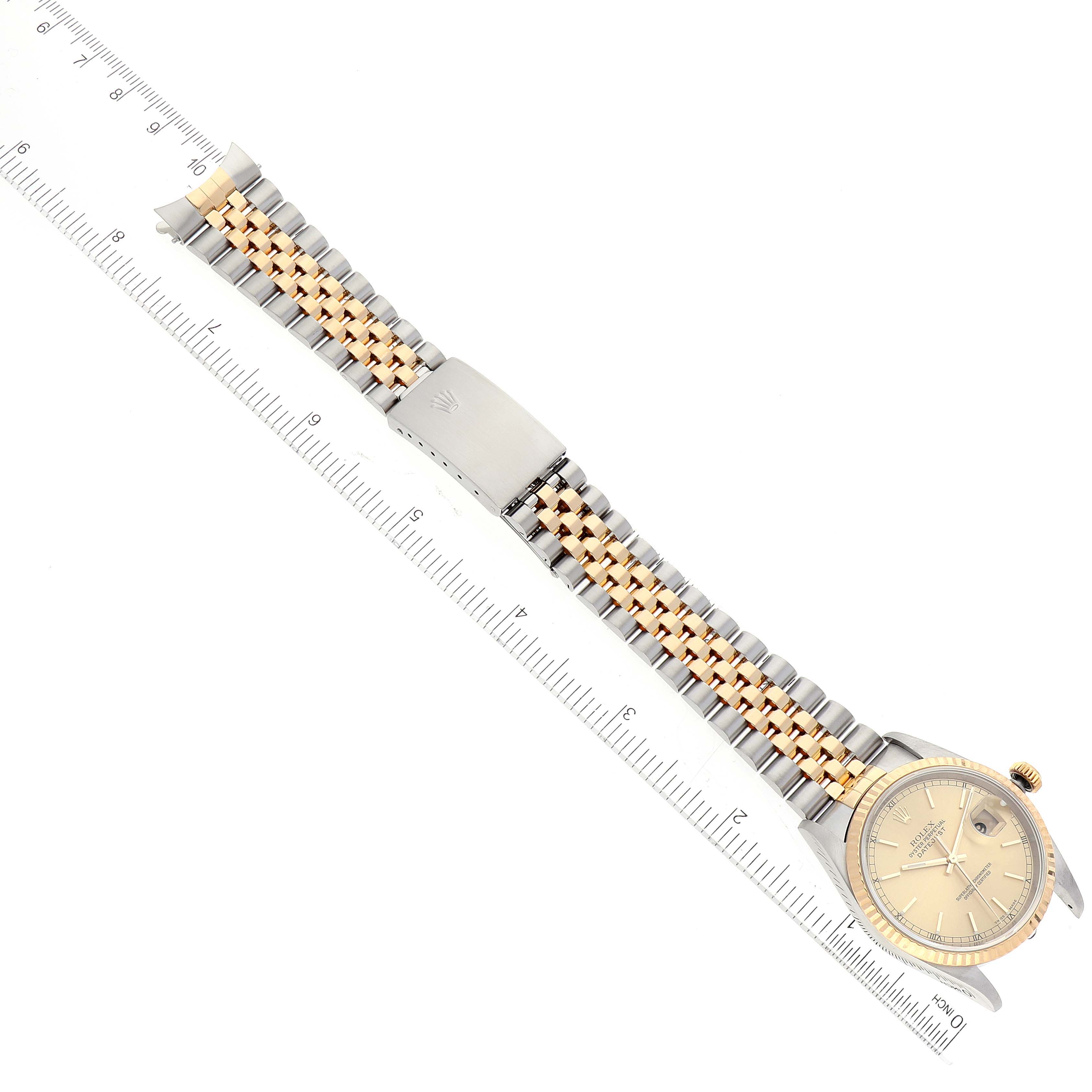 The Rolex Datejust 16233 Men's Steel and Gold (two tone) Champagne Dial 16233 Men's Steel and Gold (two tone) Champagne Dial watch is shown from an overhead angle, highlighting its dial, bezel, bracelet, and clasp.