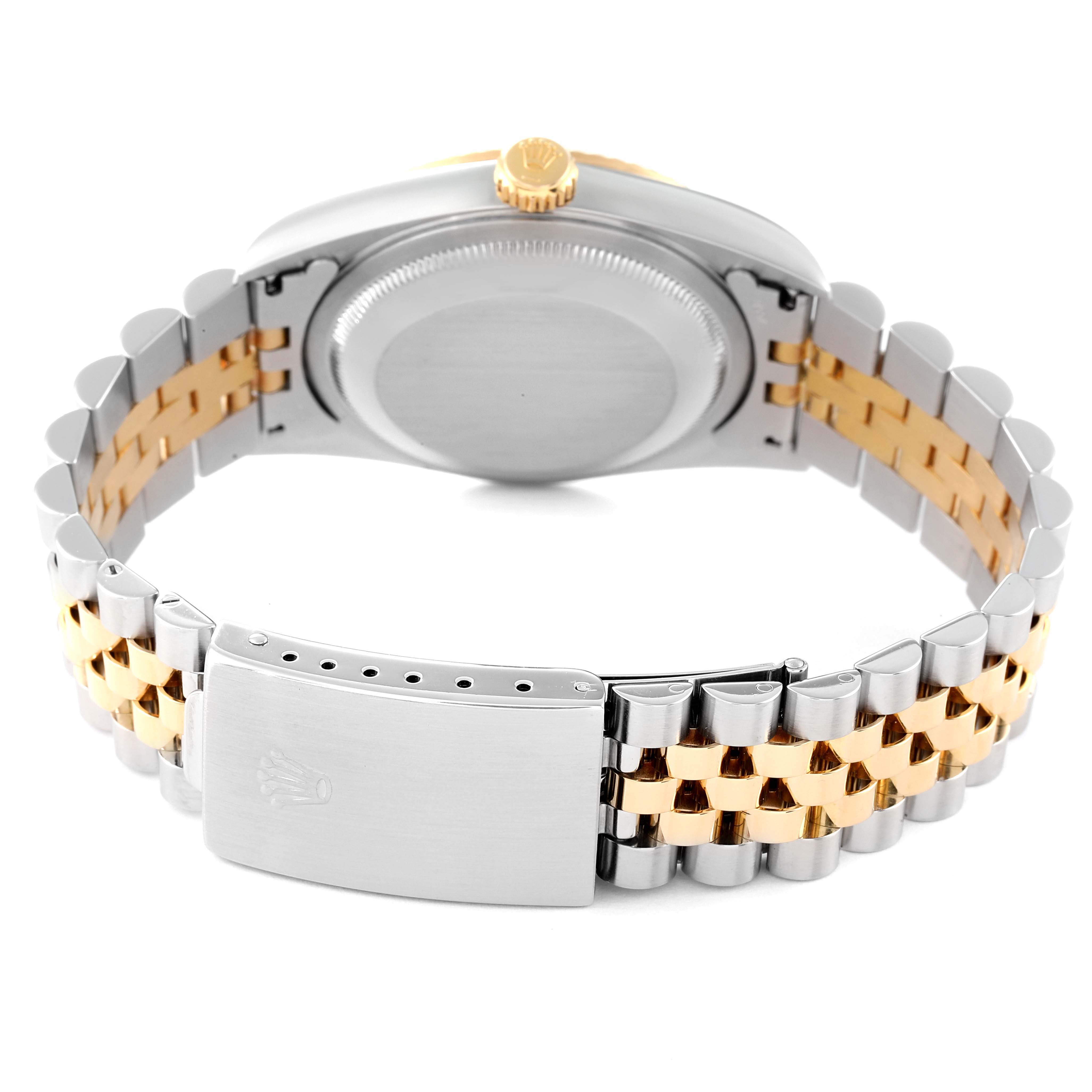 This is a rear angle view of a Rolex Datejust 16233 Men's Steel and Gold (two tone) Champagne Dial 16233 Men's Steel and Gold (two tone) Champagne Dial watch showing the clasp, bracelet, case back, and crown.